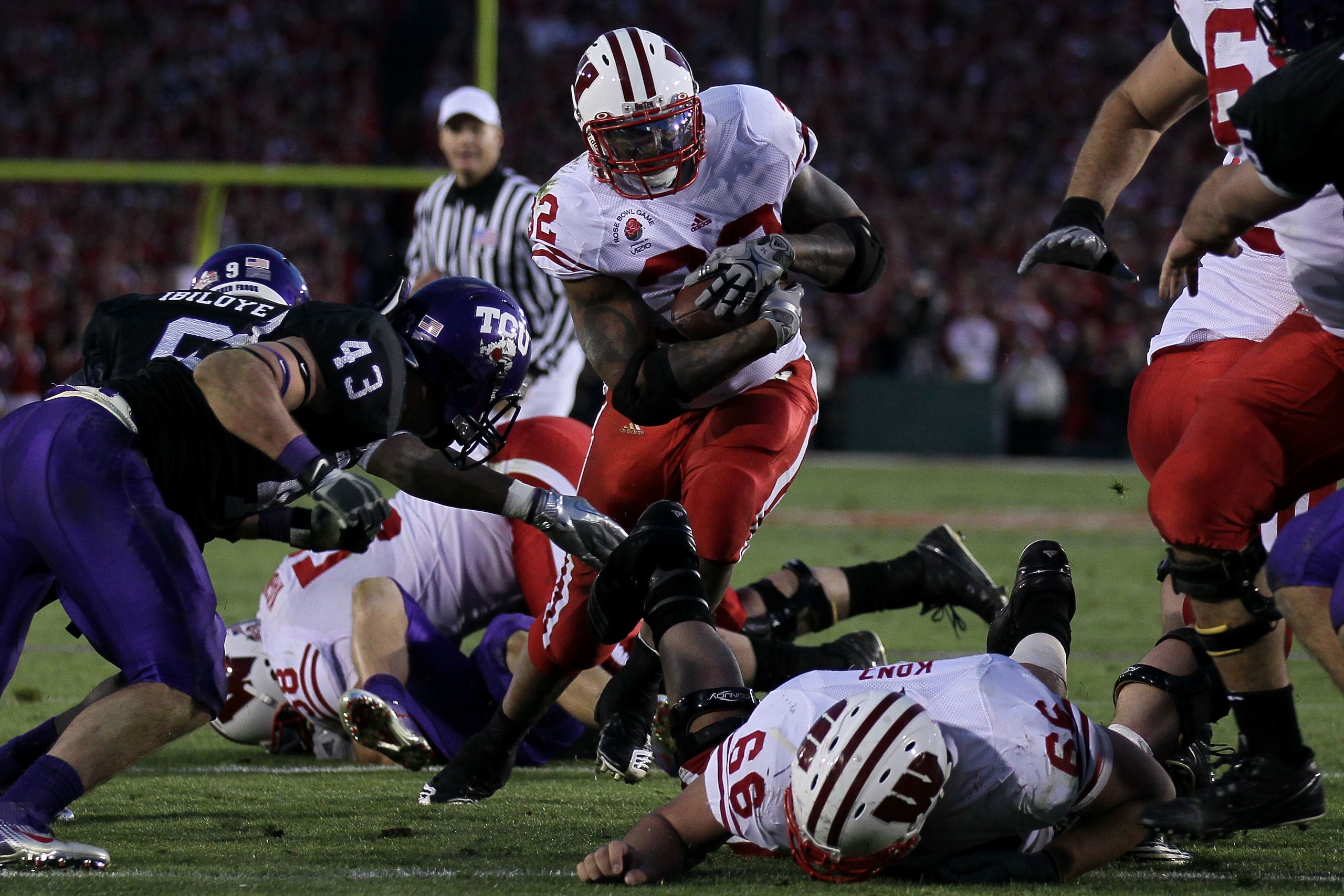 PASADENA, CA - JANUARY 01: Running back John Clay #32 of the Wisconsin Badgers rushes with the ball against the TCU Horned Frogs during the 97th Rose Bowl game on January 1, 2011 in Pasadena, California. (Photo by Stephen Dunn/Getty Images) PASADENA, CA - JANUARY 01: Running back John Clay #32 of the Wisconsin Badgers rushes with the ball against the TCU Horned Frogs during the 97th Rose Bowl game on January 1, 2011 in Pasadena, California. (Photo by Stephen Dunn/Getty Images)