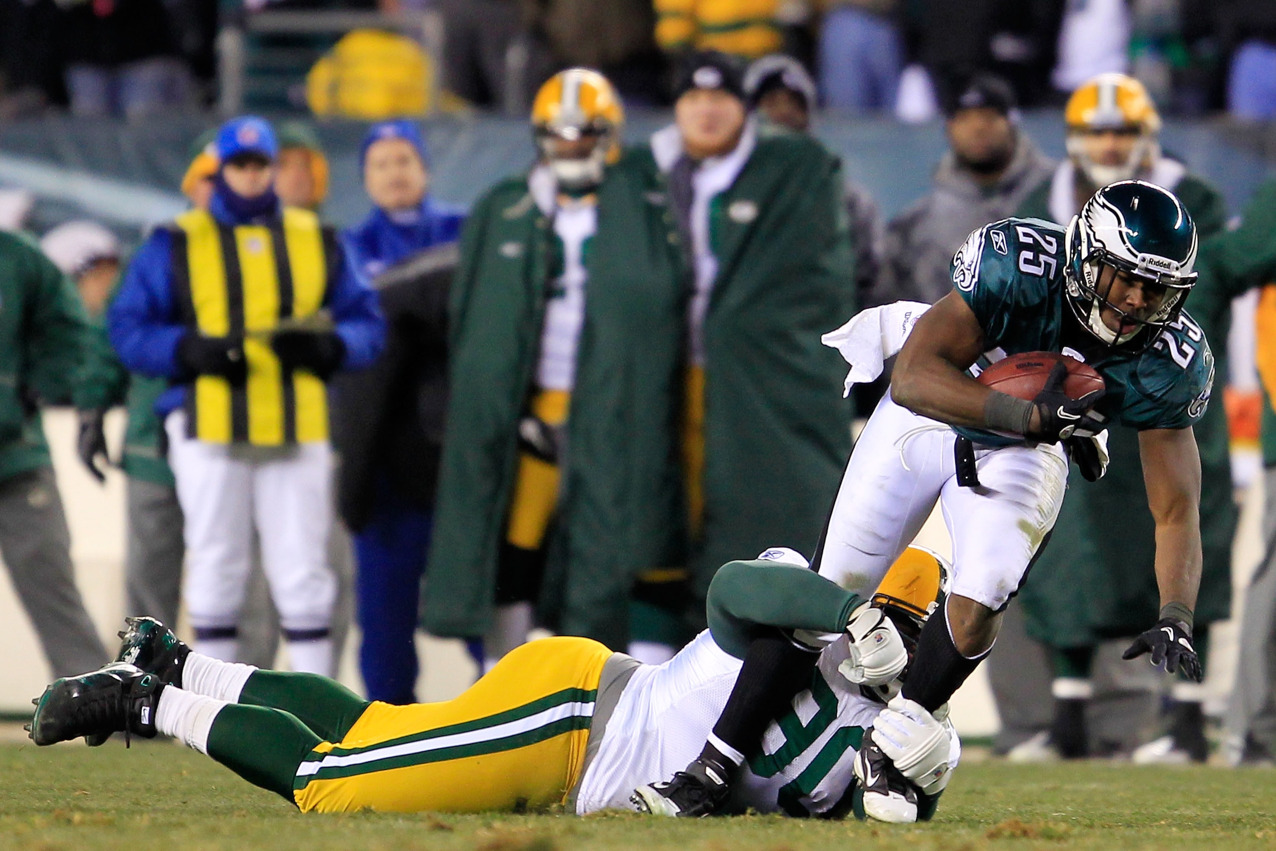 PHILADELPHIA, PA - JANUARY 09:  LeSean McCoy #25 of the Philadelphia Eagles is tackled by Donald Driver #80 of the Green Bay Packers during the 2011 NFC wild card playoff game at Lincoln Financial Field on January 9, 2011 in Philadelphia, Pennsylvania.  (