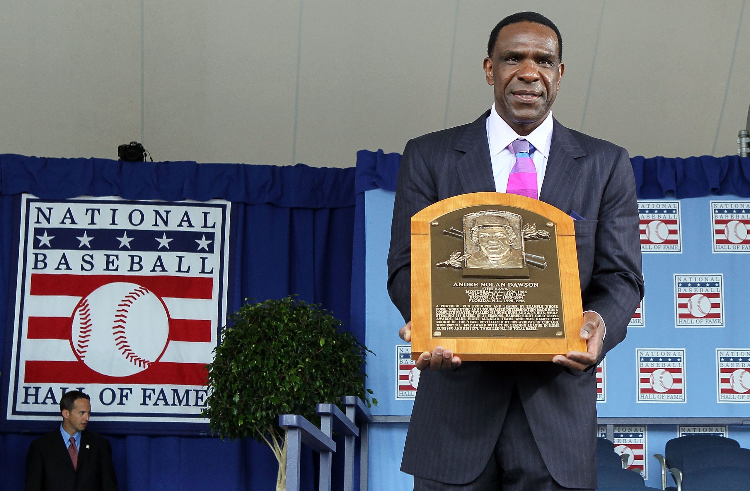 COOPERSTOWN, NY - JULY 25:  2010 inductee Andre Dawson poses for a photograph with his plaque at Clark Sports Center during the Baseball Hall of Fame induction ceremony on July 25, 20010 in Cooperstown, New York. Dawson was an eight time all-star during h