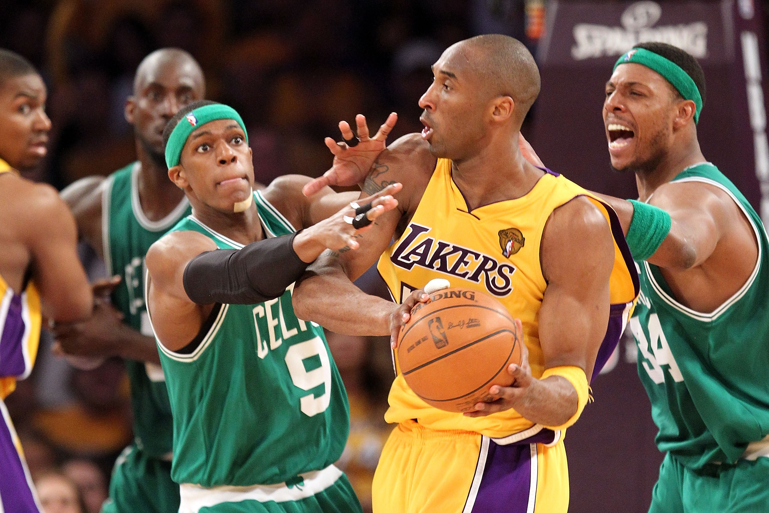 LOS ANGELES, CA - JUNE 17:  Kobe Bryant #24 of the Los Angeles Lakers is double-teammed by Rajon Rondo #9 and Paul Pierce #34 of the Boston Celtics in the third quarter of Game Seven of the 2010 NBA Finals at Staples Center on June 17, 2010 in Los Angeles
