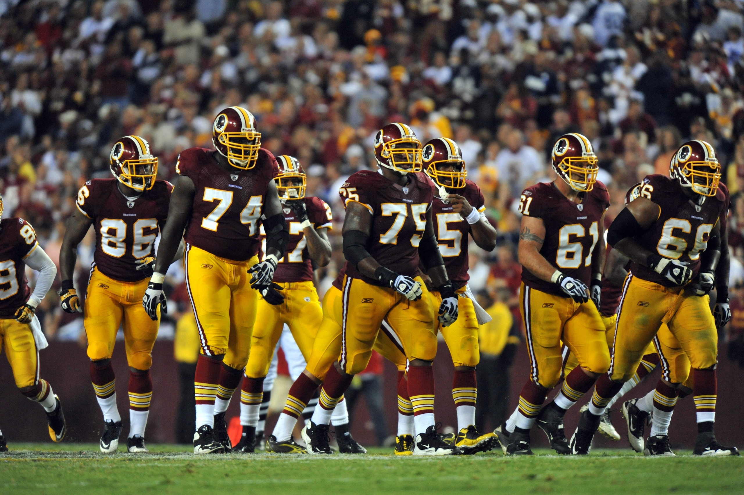 LANDOVER - SEPTEMBER 12:  The Washington Redskins offensive line walks up to the line of scrimmage during the NFL season opener against the Dallas Cowboys at FedExField on September 12, 2010 in Landover, Maryland. The Redskins defeated the Cowboys 13-7. (