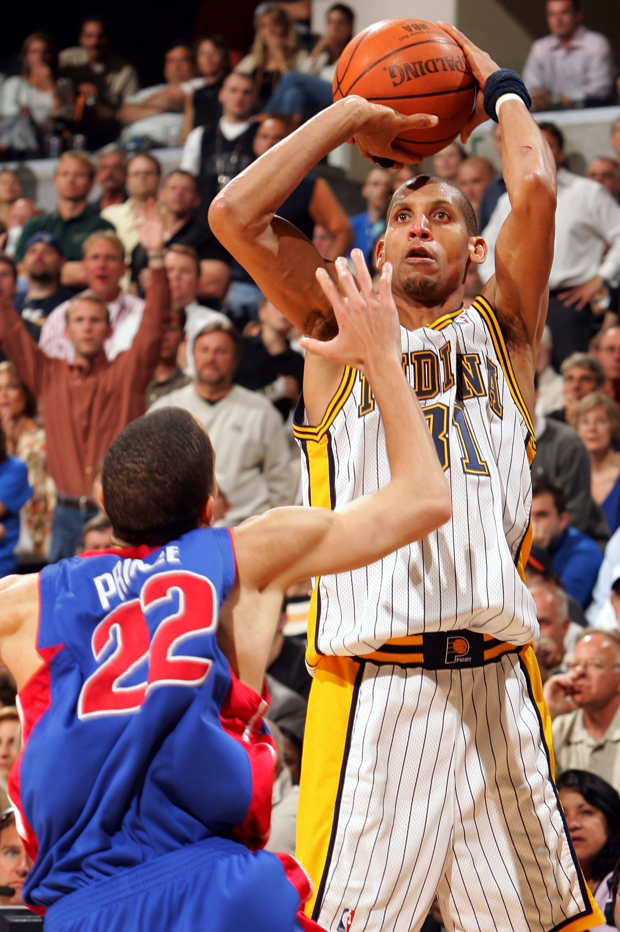 INDIANAPOLIS - MAY 19:  Reggie Miller #31 ofthe Indiana Pacers takes a shot as Tayshaun Prince #22 of the Detroit Pistons defends in Game six of the Eastern Conference Semifinals during the 2005 NBA Playoffs on May 19, 2005 at Conseco Fieldhouse in Indian
