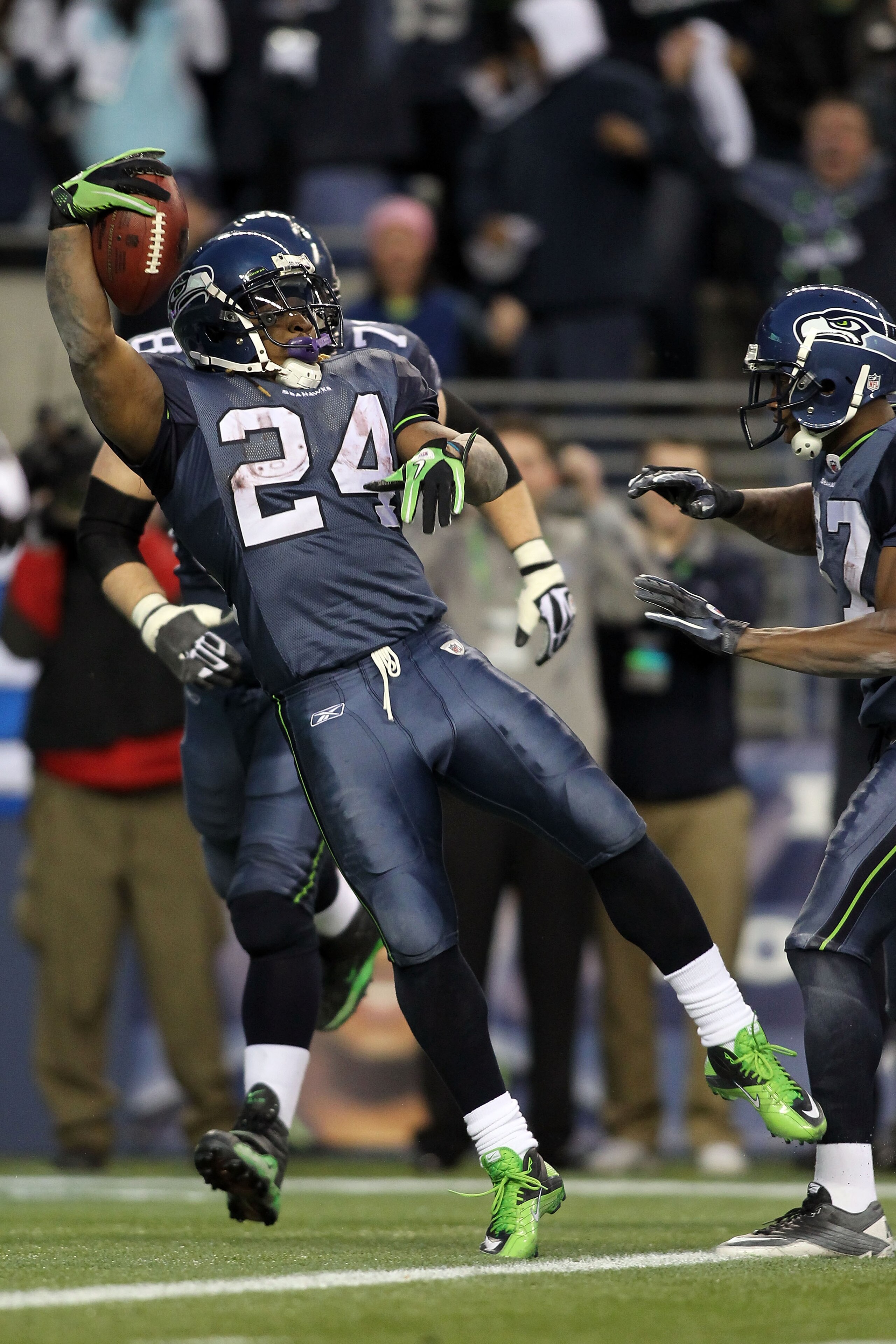 SEATTLE, WA - JANUARY 08: Running back Marshawn Lynch #24 of the Seattle Seahawks jumps across the goalline as he runs for a 67-yard touchdown run in the fourth quarter against the New Orleans Saints during the 2011 NFC wild-card playoff game at Qwest Fi SEATTLE, WA - JANUARY 08: Running back Marshawn Lynch #24 of the Seattle Seahawks jumps across the goalline as he runs for a 67-yard touchdown run in the fourth quarter against the New Orleans Saints during the 2011 NFC wild-card playoff game at Qwest Fi