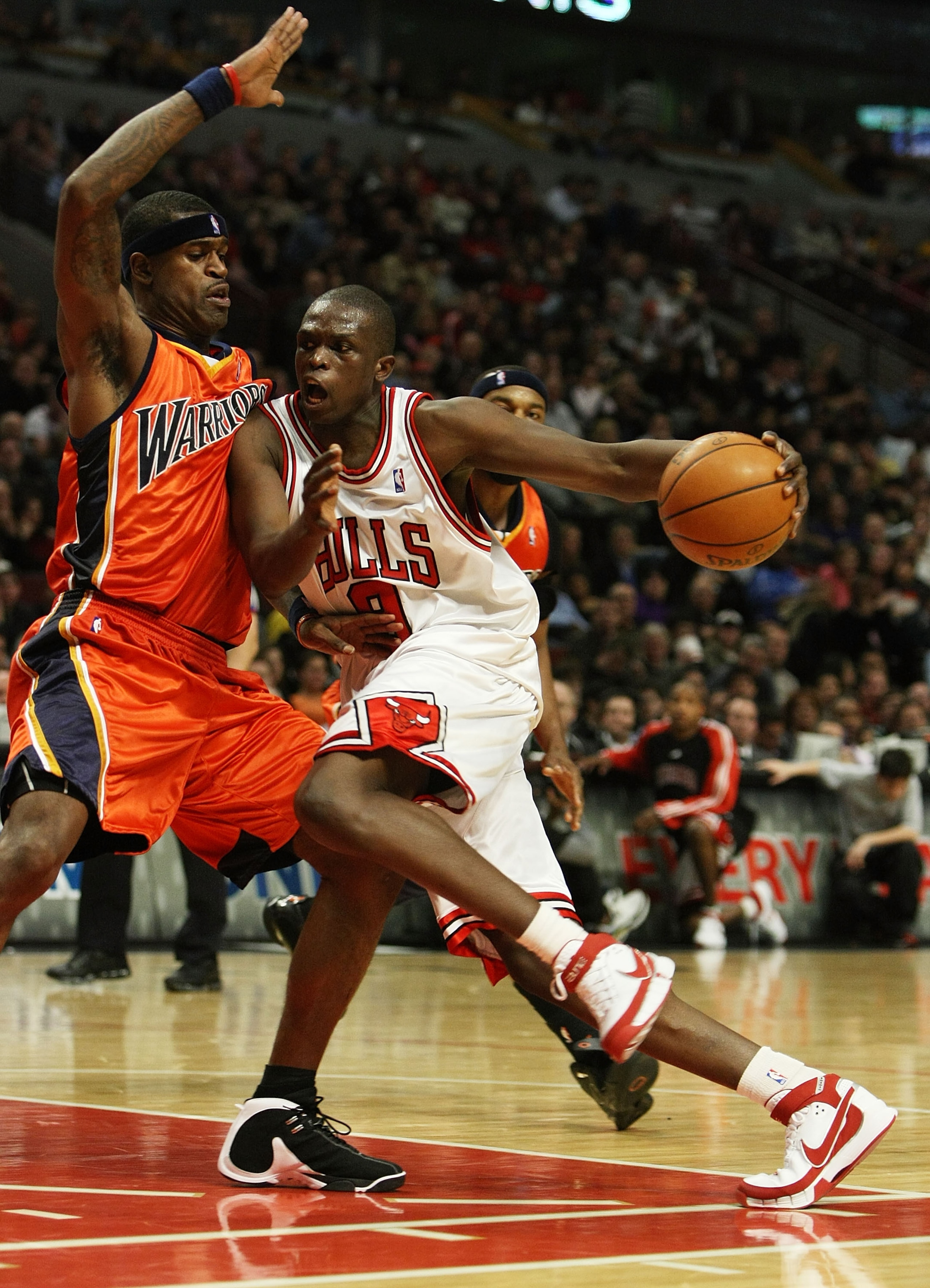 CHICAGO - JANUARY 18: Luol Deng #9 of the Chicago Bulls drives against Stephen Jackson #1 of the Golden State Warriors on January 18, 2008 at the United Center in Chicago, Illinois. The Warriors defeated the Bulls 119-111. NOTE TO USER: User expressly ack CHICAGO - JANUARY 18: Luol Deng #9 of the Chicago Bulls drives against Stephen Jackson #1 of the Golden State Warriors on January 18, 2008 at the United Center in Chicago, Illinois. The Warriors defeated the Bulls 119-111. NOTE TO USER: User expressly ack