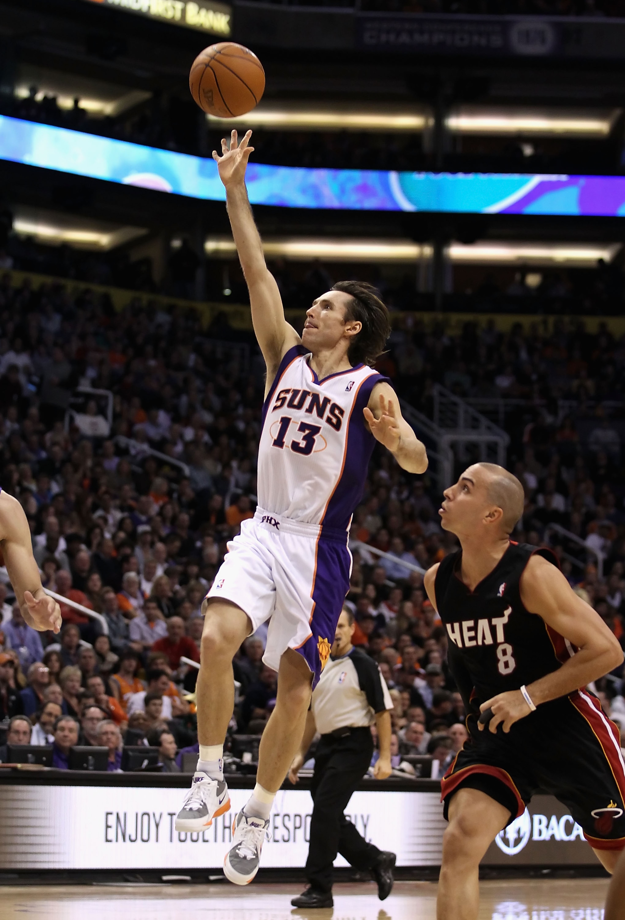 PHOENIX - DECEMBER 23:  Steve Nash #13 of the Phoenix Suns puts up a shot against the Miami Heat during the NBA game at US Airways Center on December 23, 2010 in Phoenix, Arizona. NOTE TO USER: User expressly acknowledges and agrees that, by downloading a
