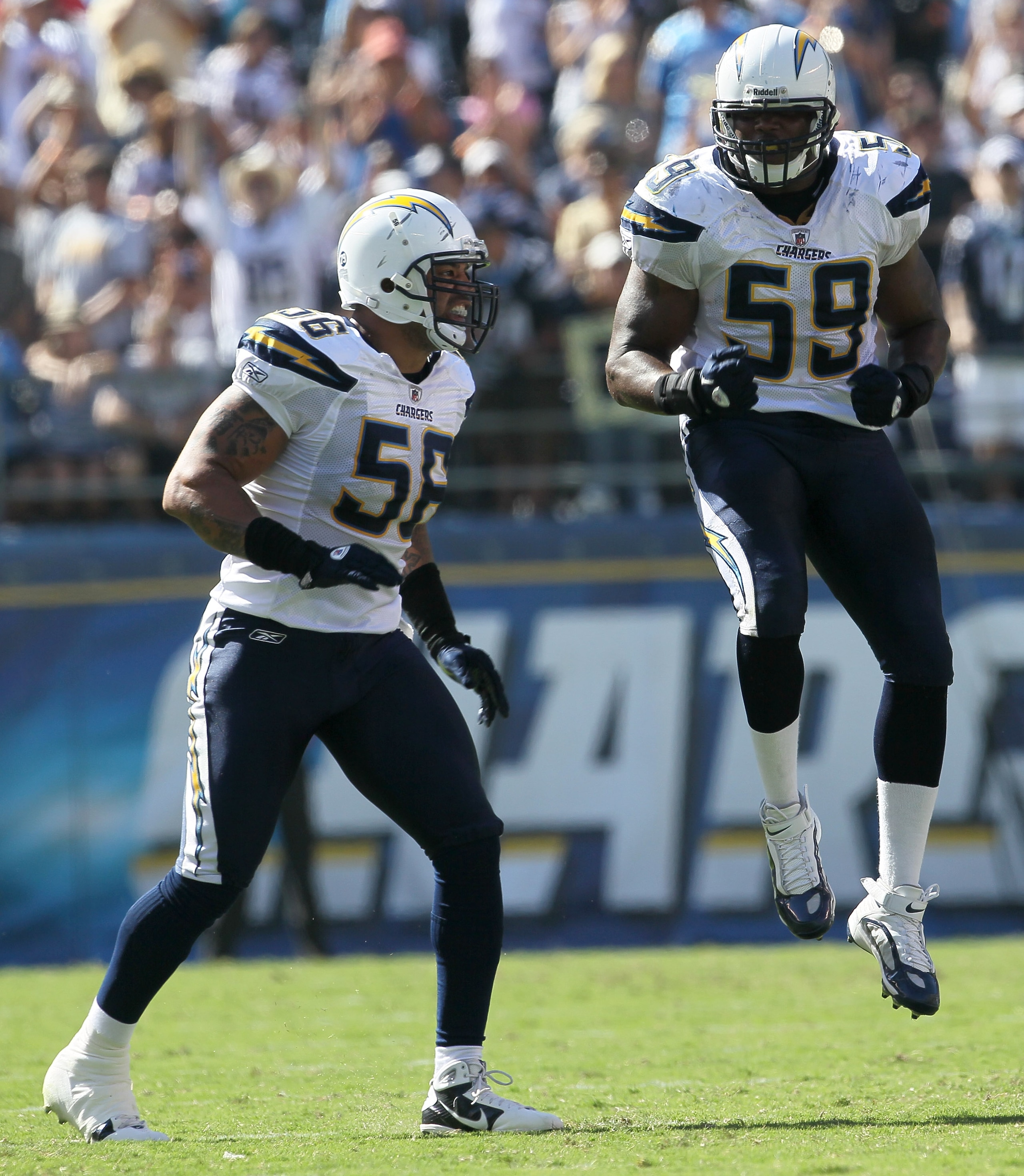 SAN DIEGO - SEPTEMBER 19: Linebackers Shawne Merriman #56 and Larry Hart #59 of the San Diego Chargers celebrate a turnover against the Jacksonville Jaguars at Qualcomm Stadium on September 19, 2010 in San Diego, California. The Chargers won 38-13. (Pho SAN DIEGO - SEPTEMBER 19: Linebackers Shawne Merriman #56 and Larry Hart #59 of the San Diego Chargers celebrate a turnover against the Jacksonville Jaguars at Qualcomm Stadium on September 19, 2010 in San Diego, California. The Chargers won 38-13. (Pho