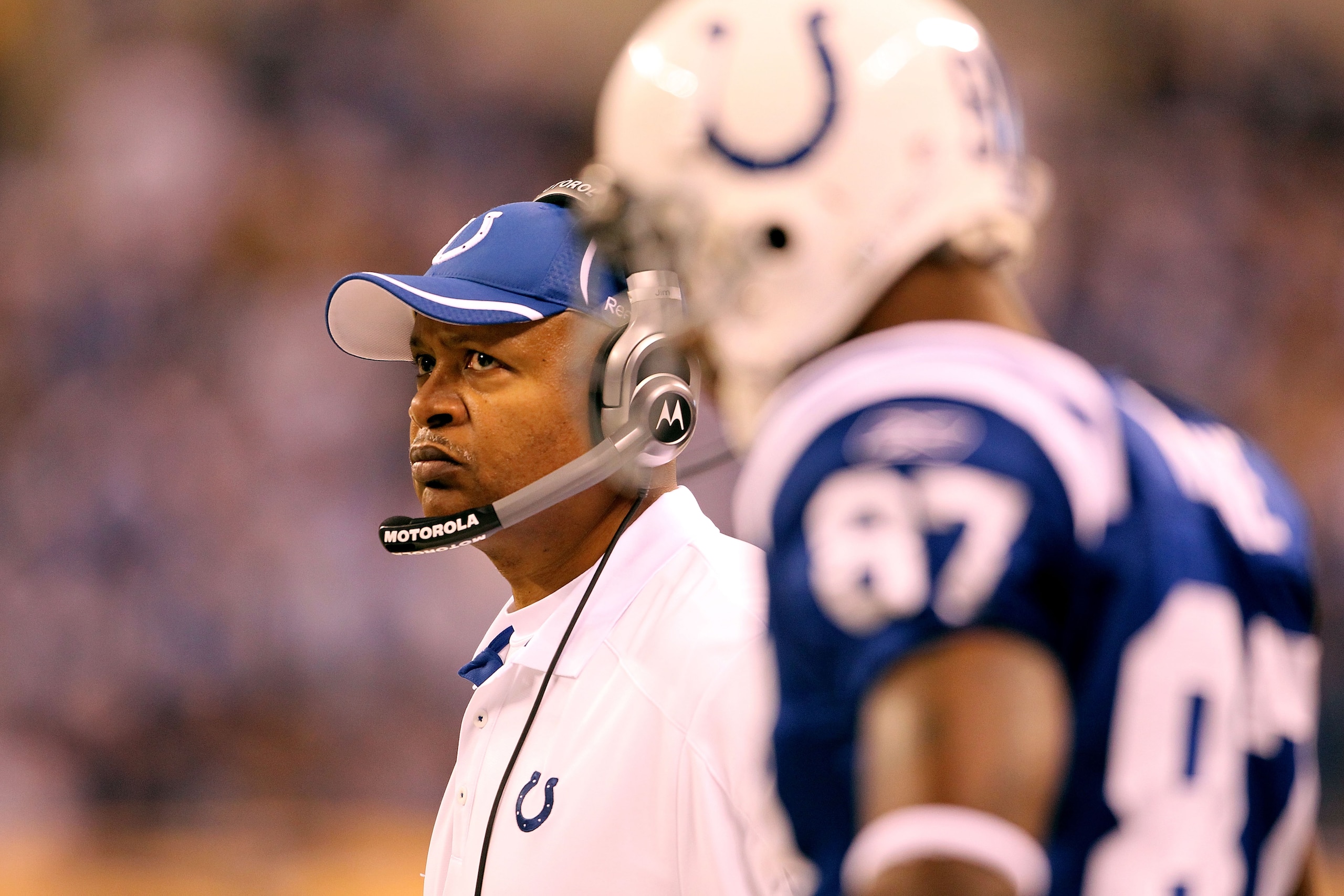 INDIANAPOLIS, IN - JANUARY 08:  (L-R) Head coach Jim Caldwell and Reggie Wayne #87 of the Indianapolis Colts looks on against the New York Jets during their 2011 AFC wild card playoff game at Lucas Oil Stadium on January 8, 2011 in Indianapolis, Indiana. 
