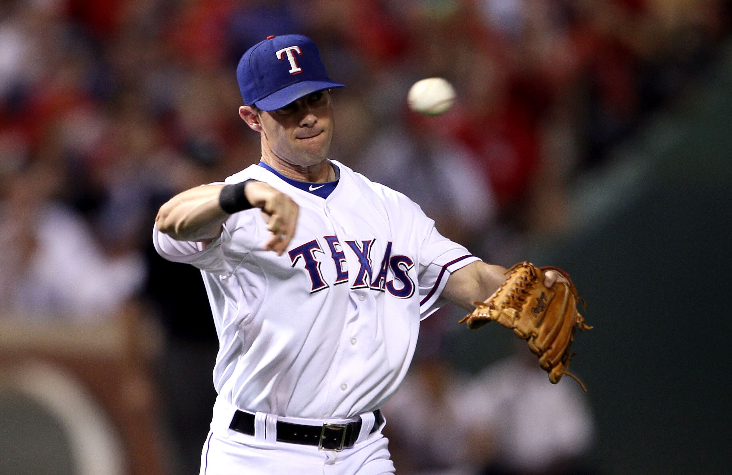 ARLINGTON, TX - OCTOBER 22:  Michael Young #10 of the Texas Rangers throws the ball against the New York Yankees in Game Six of the ALCS during the 2010 MLB Playoffs at Rangers Ballpark in Arlington on October 22, 2010 in Arlington, Texas.  (Photo by Elsa