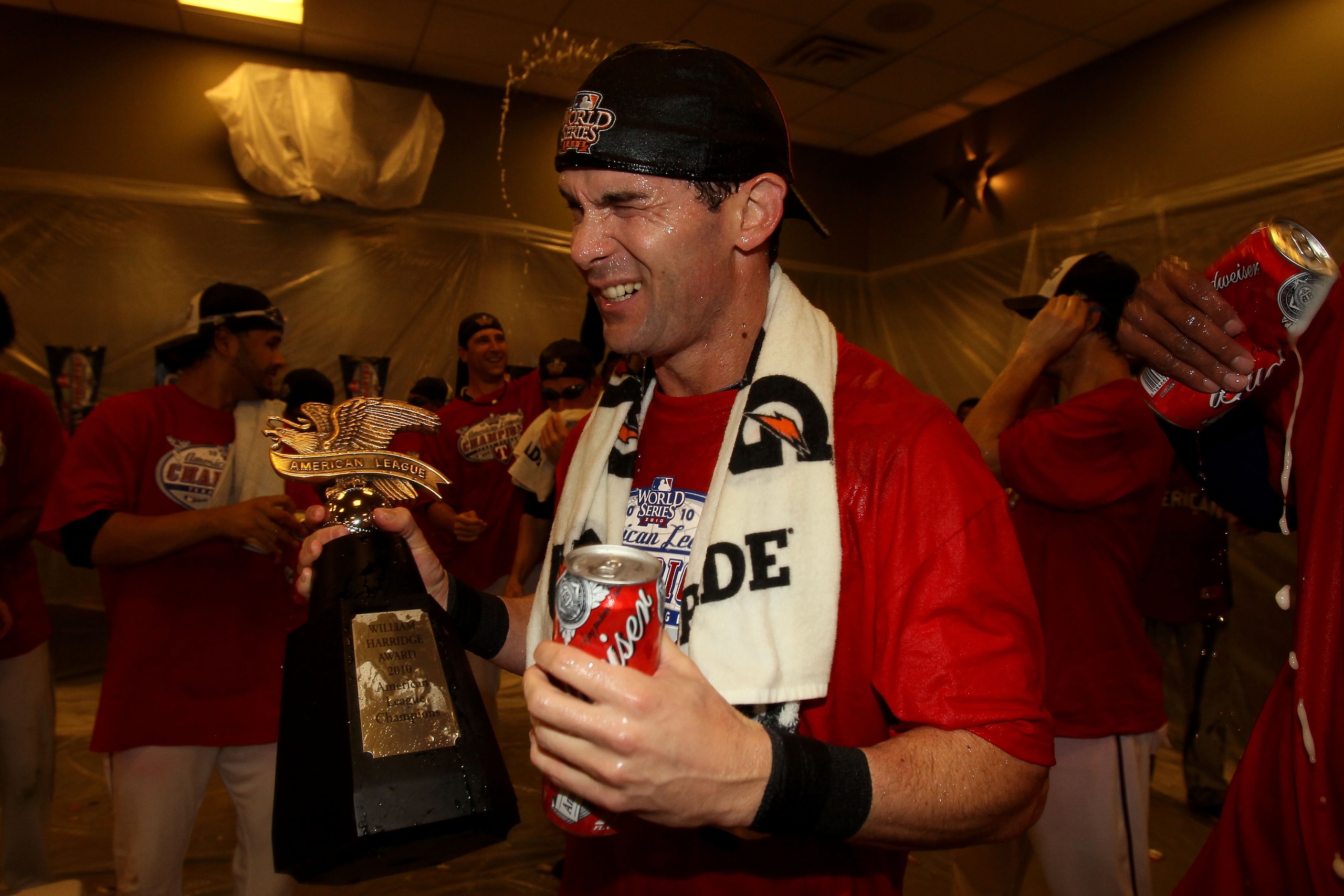 ARLINGTON, TX - OCTOBER 22:  Michael Young #10 of the Texas Rangers celebrates in the lockerroom with teammates after defeating the New York Yankees 6-1 in Game Six of the ALCS to advance to the World Series during the 2010 MLB Playoffs at Rangers Ballpar