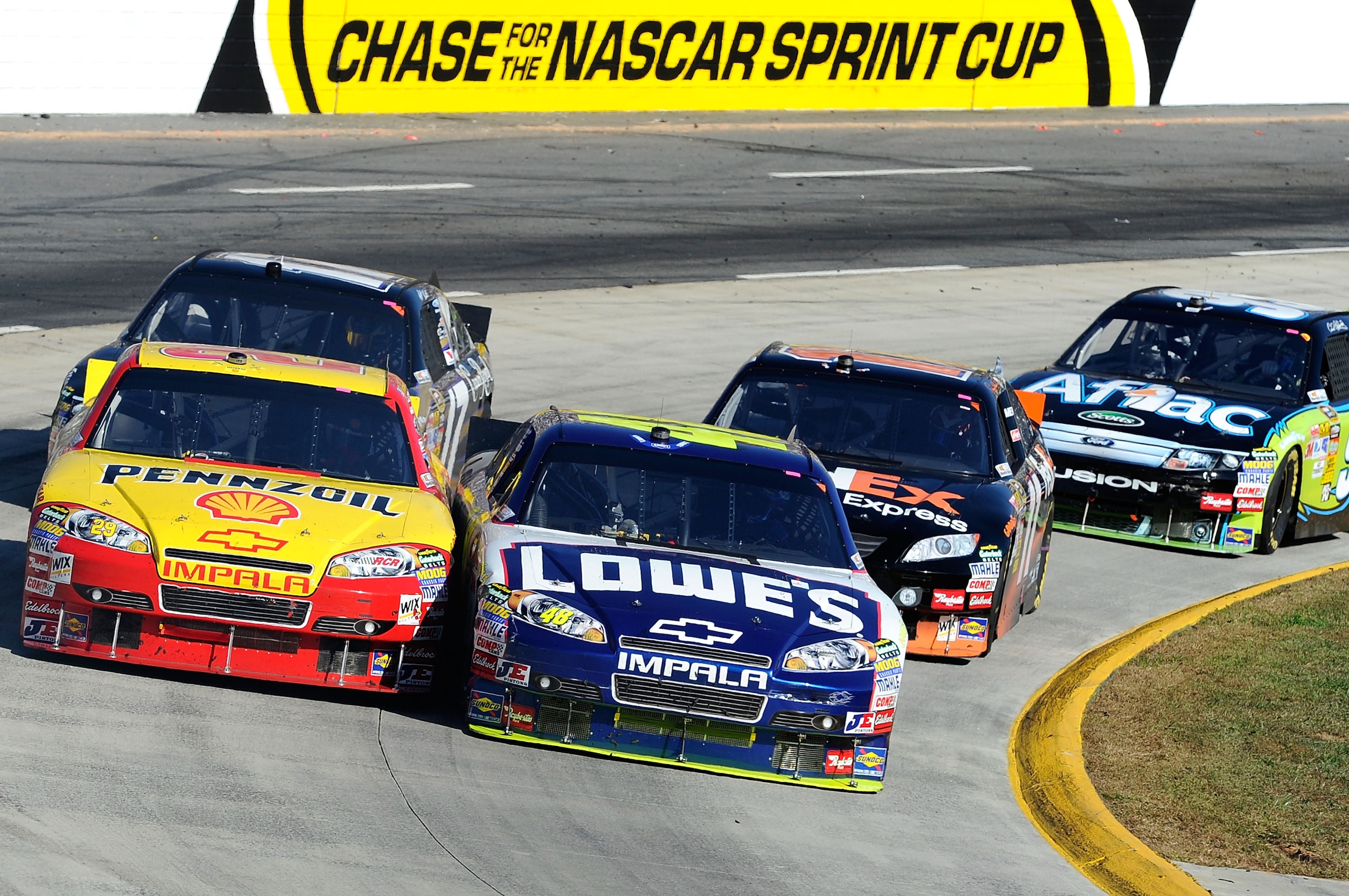 MARTINSVILLE, VA - OCTOBER 24:  Kevin Harvick, driver of the #29 Shell/Pennzoil Chevrolet, races Jimmie Johnson, driver of the #48 Lowe's Chevrolet, during the NASCAR Sprint Cup Series TUMS Fast Relief 500 at Martinsville Speedway on October 24, 2010 in M