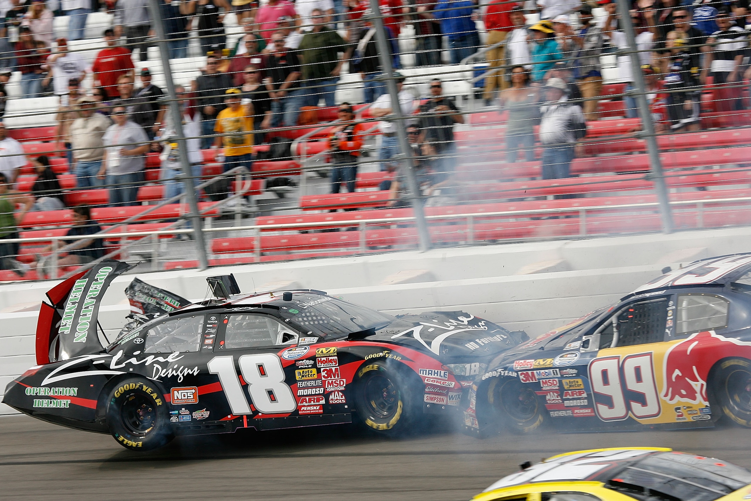 LAS VEGAS - FEBRUARY 28:  Kyle Busch driver of the #18 Z-Line Designs Toyota and Scott Speed driver of the #99 Red Bull Toyota crash in turn four during the NASCAR Nationwide Series Sam's Town 300 at the Las Vegas Motor Speedway on February 28, 2009 in La