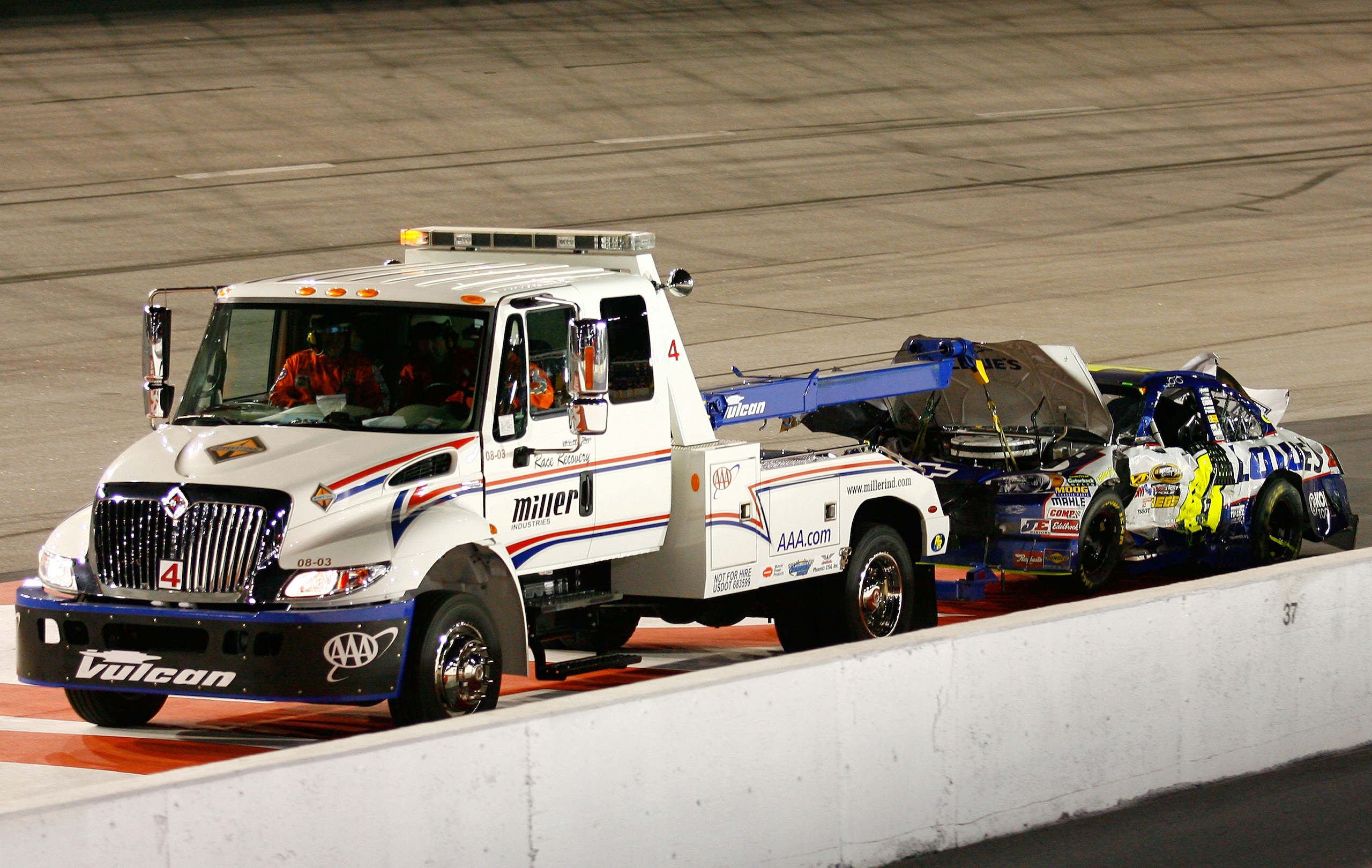 DARLINGTON, SC - MAY 08:  The #48 Lowe's Chevrolet, driven by Jimmie Johnson (not pictured) is towed off the track after Johnson crashed during the NASCAR Sprint Cup series SHOWTIME Southern 500 at Darlington Raceway on May 8, 2010 in Darlington, South Ca