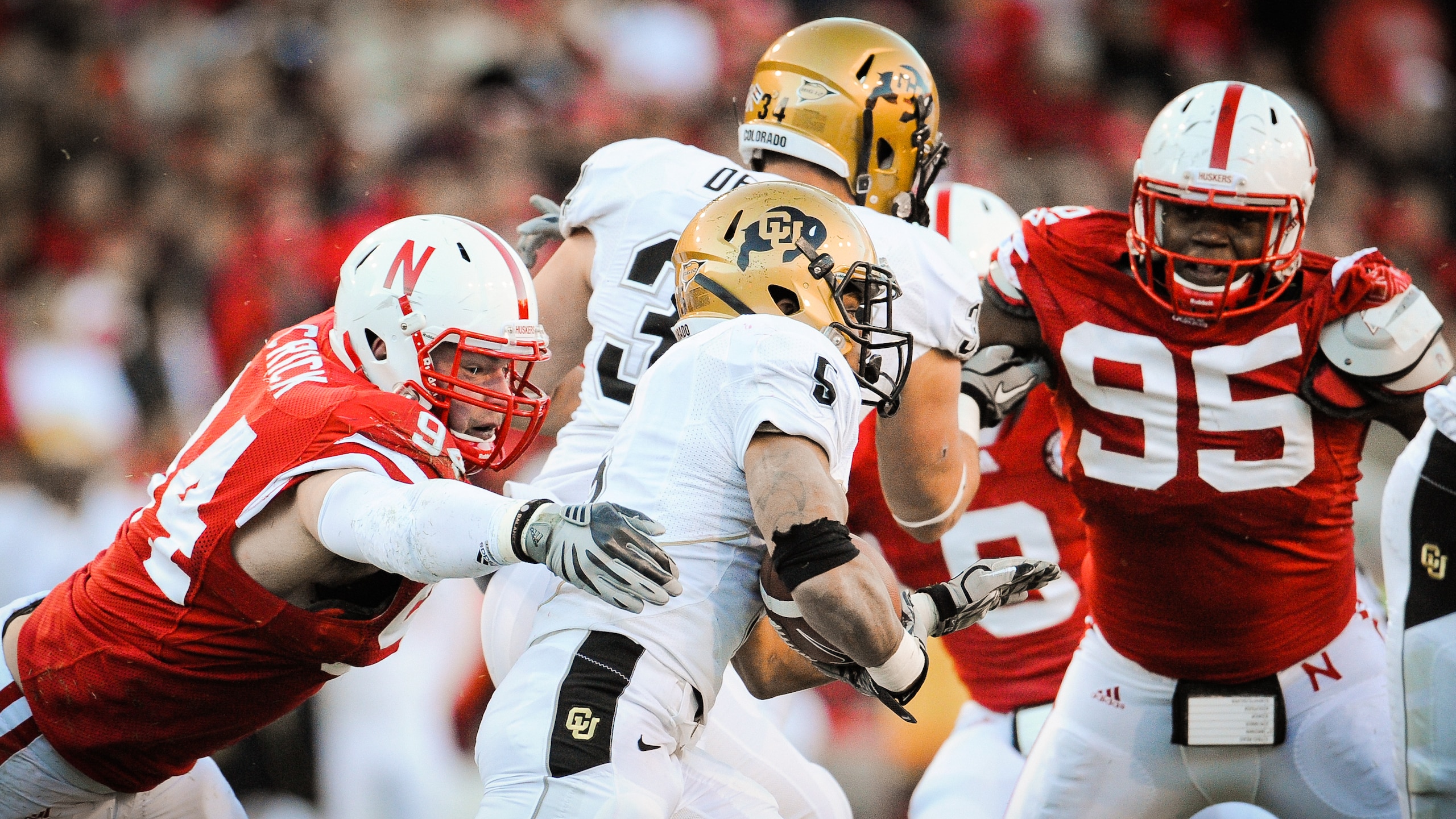 LINCOLN, NE - NOVEMBER 26: Jared Crick #94 and Pierre Allen #95 of the Nebraska Cornhuskers zero in on for Rodney Stewart #5 of the Colorado Buffaloes during their game at Memorial Stadium on November 26, 2010 in Lincoln, Nebraska. Nebraska defeated Color LINCOLN, NE - NOVEMBER 26: Jared Crick #94 and Pierre Allen #95 of the Nebraska Cornhuskers zero in on for Rodney Stewart #5 of the Colorado Buffaloes during their game at Memorial Stadium on November 26, 2010 in Lincoln, Nebraska. Nebraska defeated Color
