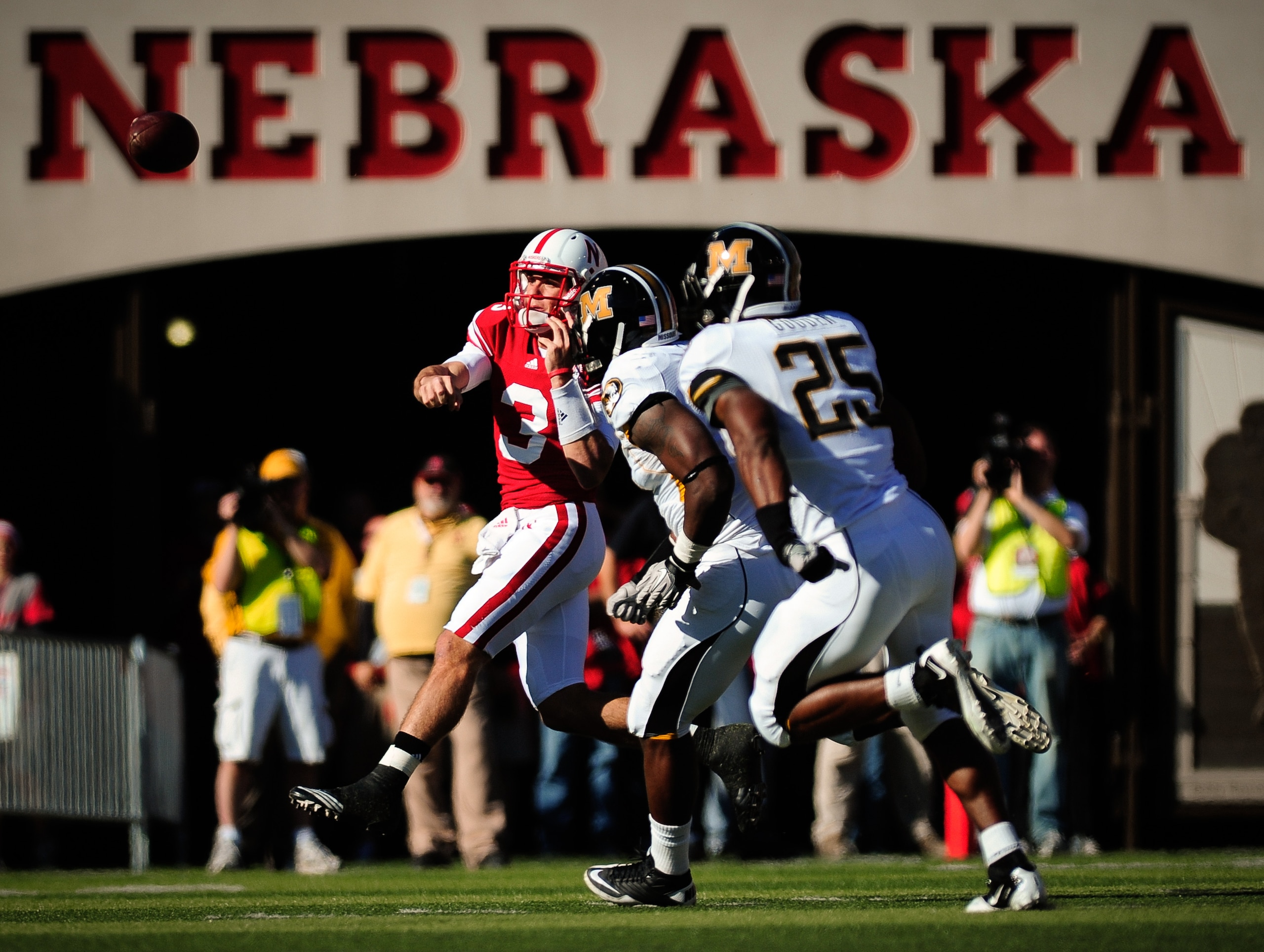LINCOLN, NE - OCTOBER 30: Quarterback Taylor Martinez #3 of the Nebraska Cornhuskers throws over the Missouri Tigers defense during first half action of their game at Memorial Stadium on October 30, 2010 in Lincoln, Nebraska. Nebraska Defeated Missouri 31 LINCOLN, NE - OCTOBER 30: Quarterback Taylor Martinez #3 of the Nebraska Cornhuskers throws over the Missouri Tigers defense during first half action of their game at Memorial Stadium on October 30, 2010 in Lincoln, Nebraska. Nebraska Defeated Missouri 31