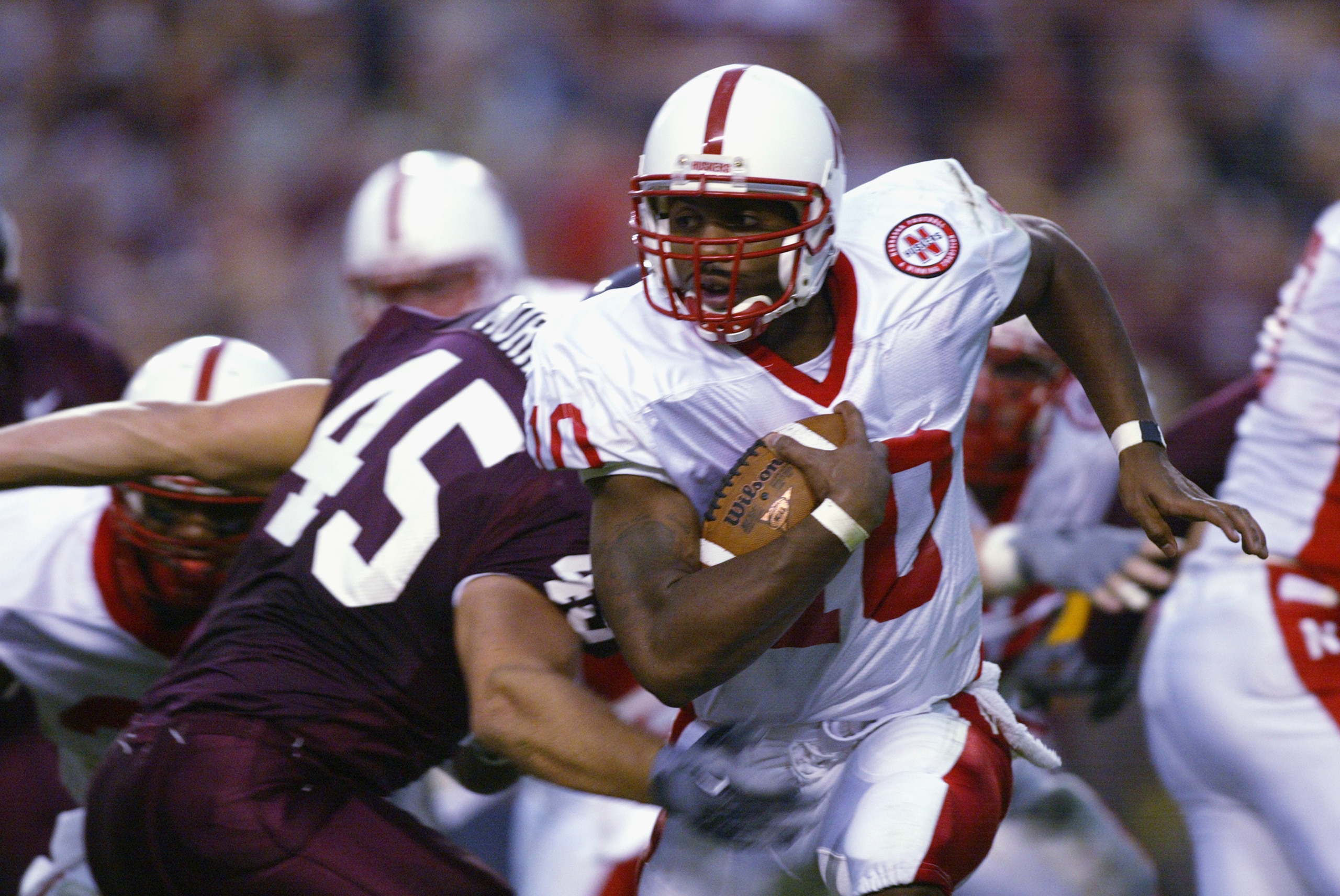 COLLEGE STATION, TX - OCTOBER 26: Jammal Lord #10 quarterback for the Nebraska Cornhuskers carries the ball as Jared Morris #45 of the Texas A&M Aggies defends in the game on October 26, 2002 at Kyle Field at College Station, Texas. (Photo by Stephen Dun COLLEGE STATION, TX - OCTOBER 26: Jammal Lord #10 quarterback for the Nebraska Cornhuskers carries the ball as Jared Morris #45 of the Texas A&M Aggies defends in the game on October 26, 2002 at Kyle Field at College Station, Texas. (Photo by Stephen Dun