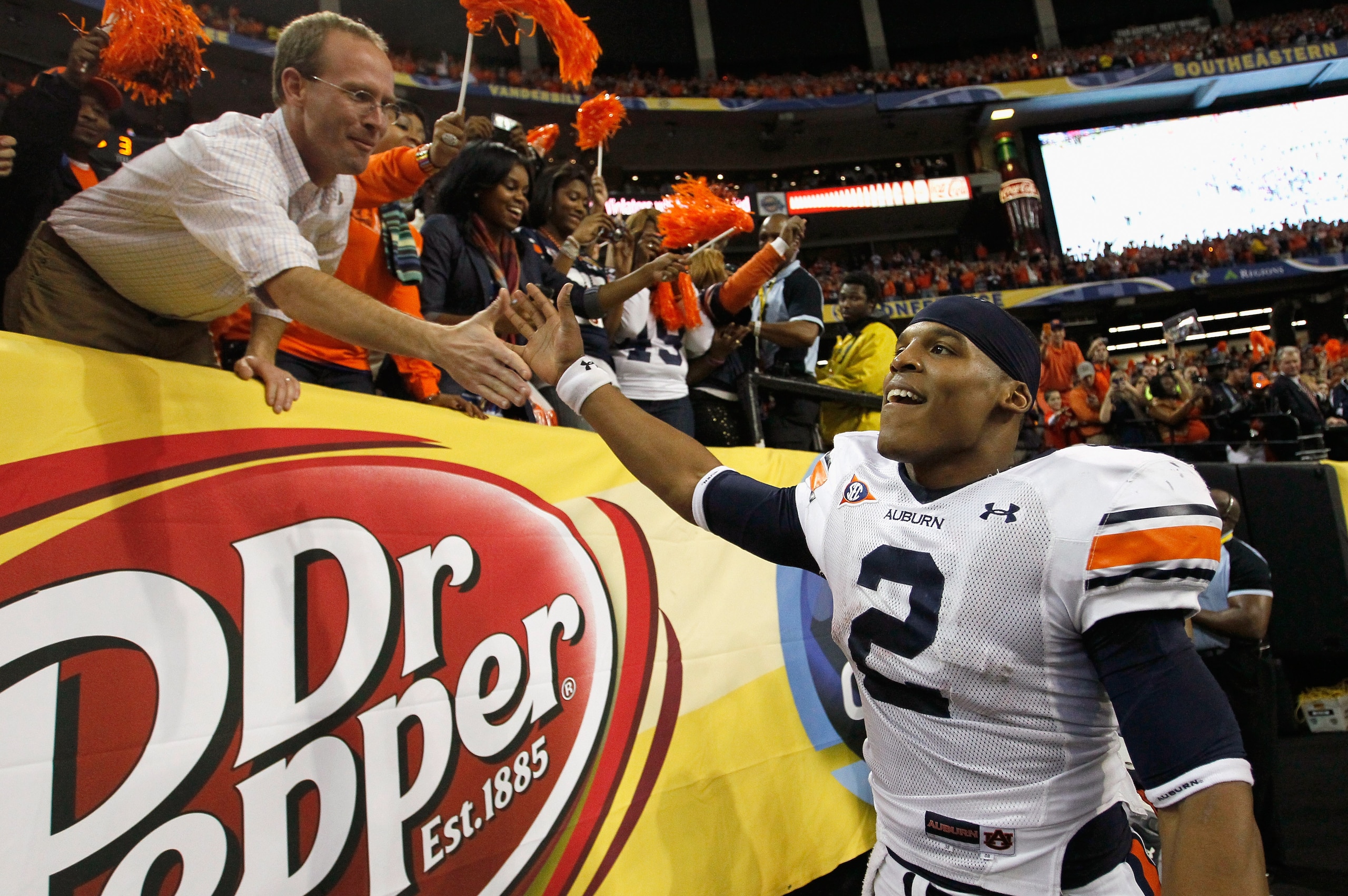 ATLANTA, GA - DECEMBER 04:  Quarterback Cam Newton #2 of the Auburn Tigers celebrates after their 56-17 win over the South Carolina Gamecocks during the 2010 SEC Championship at Georgia Dome on December 4, 2010 in Atlanta, Georgia.  (Photo by Kevin C. Cox