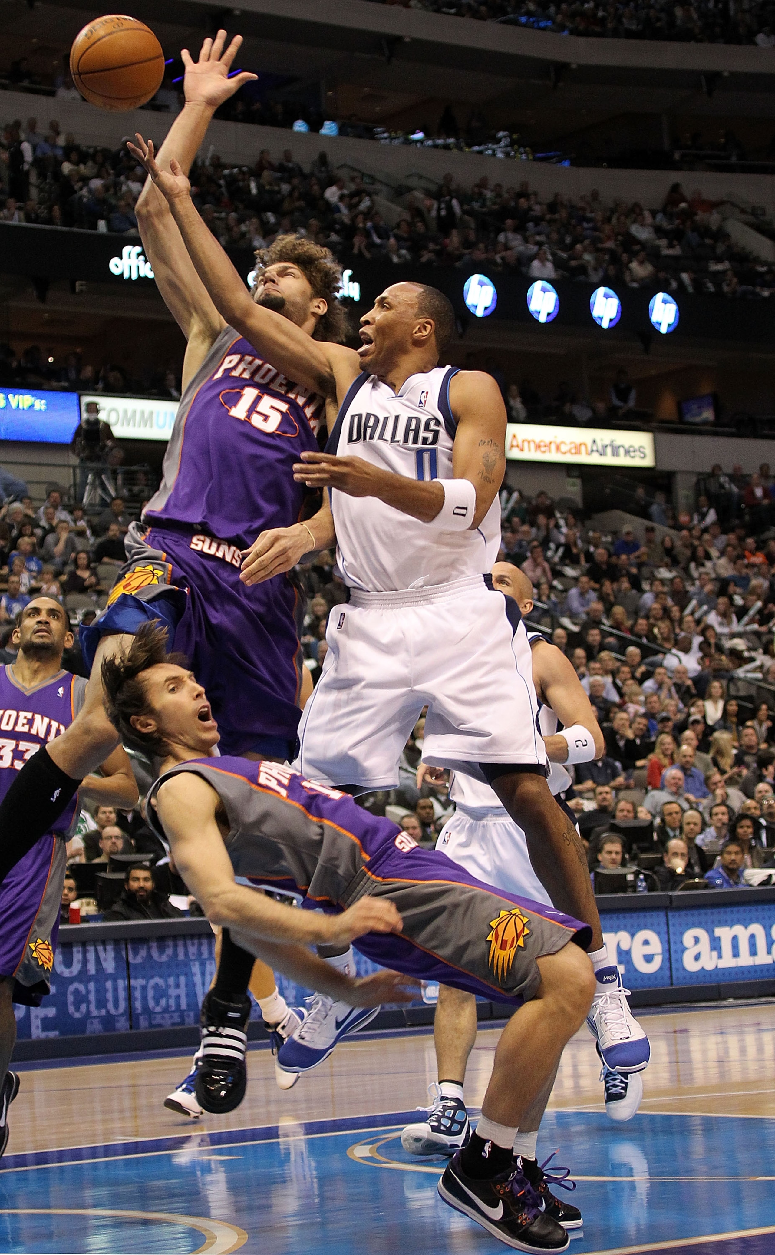 DALLAS - FEBRUARY 17: Forward Shawn Marion #0 of the Dallas Mavericks fouls Steve Nash #13 of the Phoenix Suns on February 17, 2010 at American Airlines Center in Dallas, Texas. NOTE TO USER: User expressly acknowledges and agrees that, by downloading DALLAS - FEBRUARY 17: Forward Shawn Marion #0 of the Dallas Mavericks fouls Steve Nash #13 of the Phoenix Suns on February 17, 2010 at American Airlines Center in Dallas, Texas. NOTE TO USER: User expressly acknowledges and agrees that, by downloading