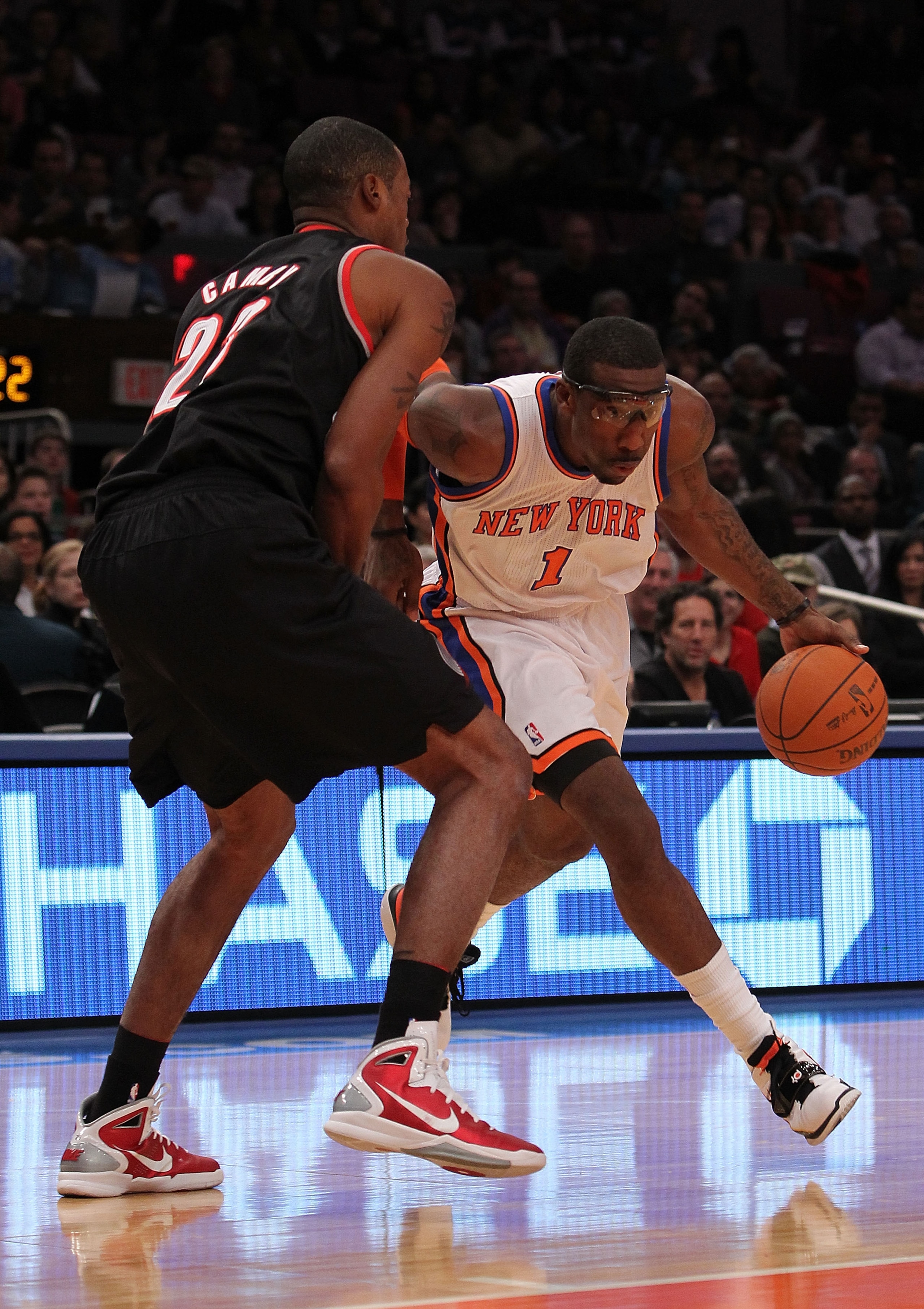 NEW YORK - OCTOBER 30: Amar'e Stoudemire #1 of the New York Knicks drives against Marcus Camby #23 of the Portland Trail Blazers at Madison Square Garden on October 30, 2010 in New York City. NOTE TO USER: User expressly acknowledges and agrees that, by NEW YORK - OCTOBER 30: Amar'e Stoudemire #1 of the New York Knicks drives against Marcus Camby #23 of the Portland Trail Blazers at Madison Square Garden on October 30, 2010 in New York City. NOTE TO USER: User expressly acknowledges and agrees that, by