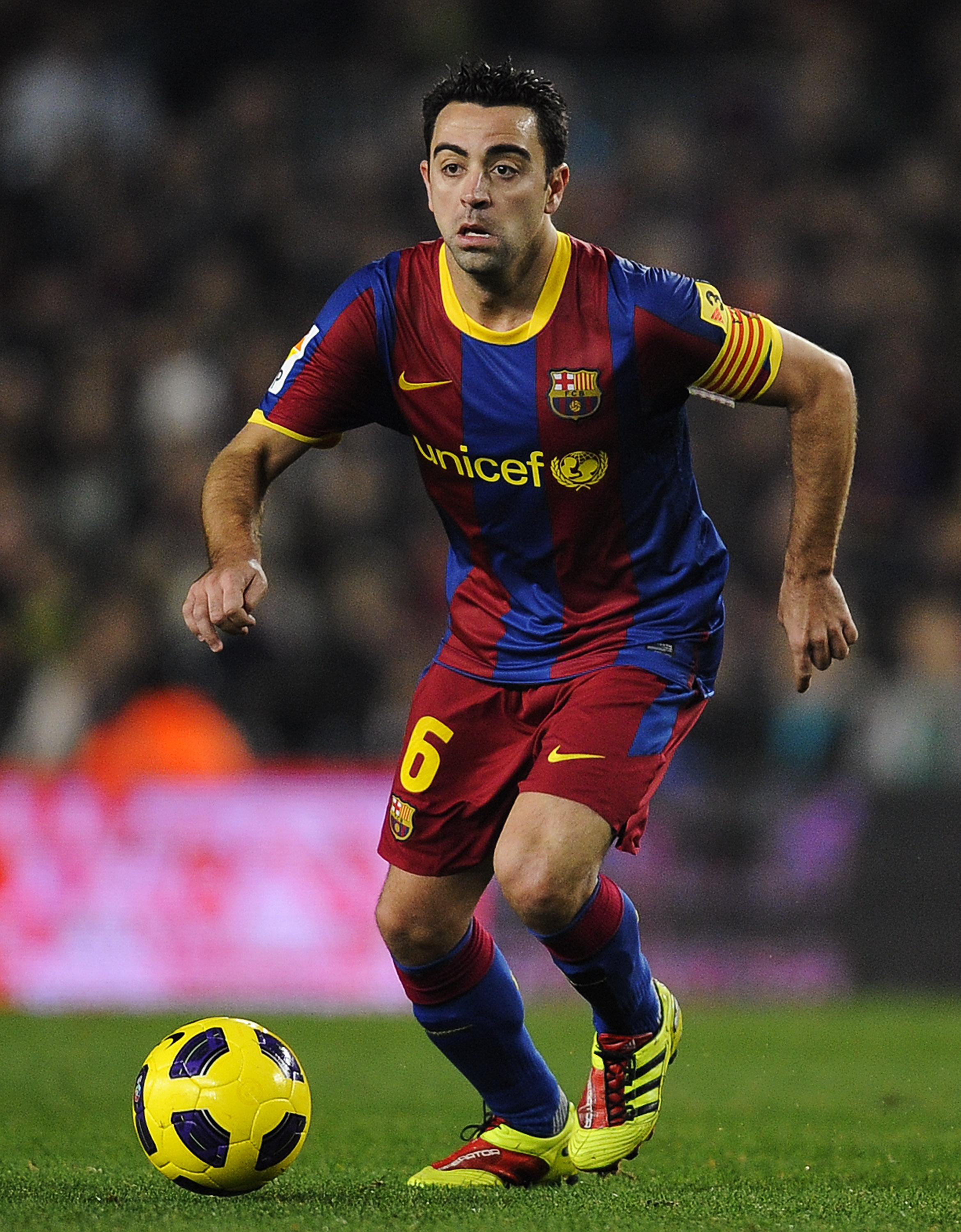 BARCELONA, SPAIN - JANUARY 02:  Xavi Hernandez of Barcelona runs with the ball during the La Liga match between Barcelona and Levante UD at Camp Nou on January 2, 2011 in Barcelona, Spain. Barcelona won 2-1.  (Photo by David Ramos/Getty Images)