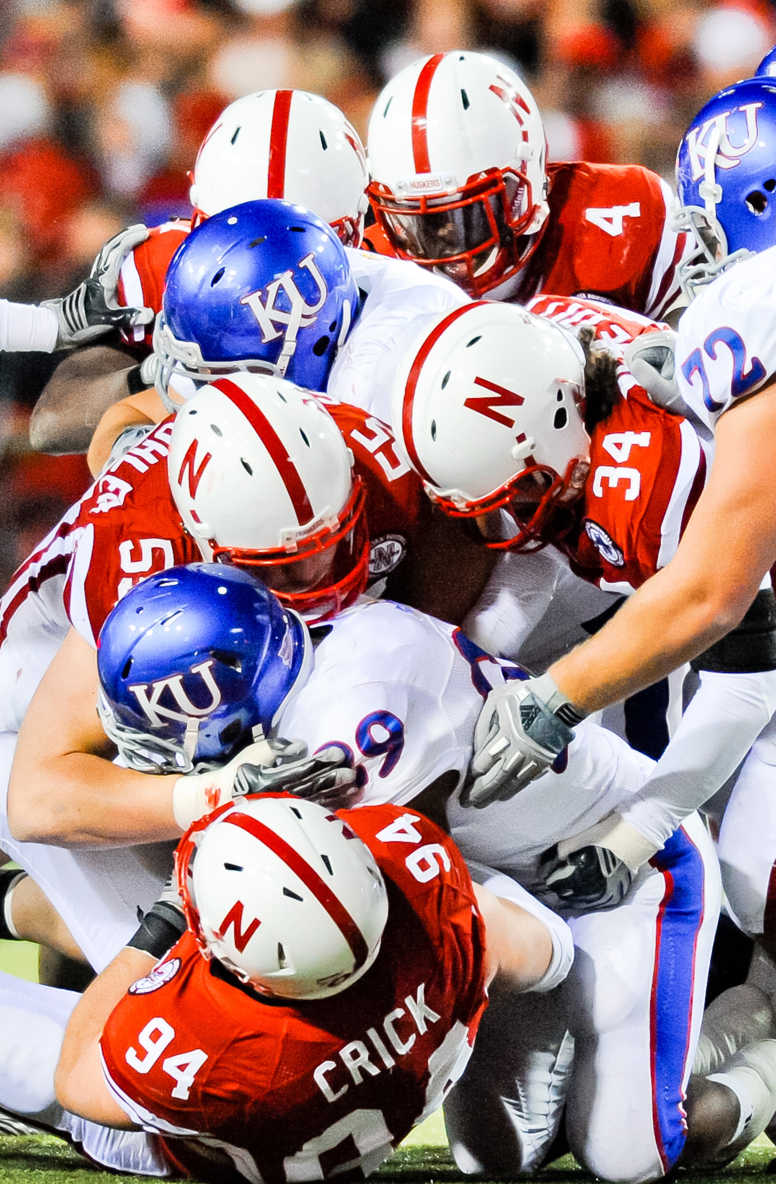 LINCOLN, NE - NOVEMBER 13: The Nebraska Cornhusker defense swarms James Sims #29 of the Kansas Jayhawks during their game at Memorial Stadium on November 13, 2010 in Lincoln, Nebraska. Nebraska Defeated Kansas 20-3. (Photo by Eric Francis/Getty Images) LINCOLN, NE - NOVEMBER 13: The Nebraska Cornhusker defense swarms James Sims #29 of the Kansas Jayhawks during their game at Memorial Stadium on November 13, 2010 in Lincoln, Nebraska. Nebraska Defeated Kansas 20-3. (Photo by Eric Francis/Getty Images)
