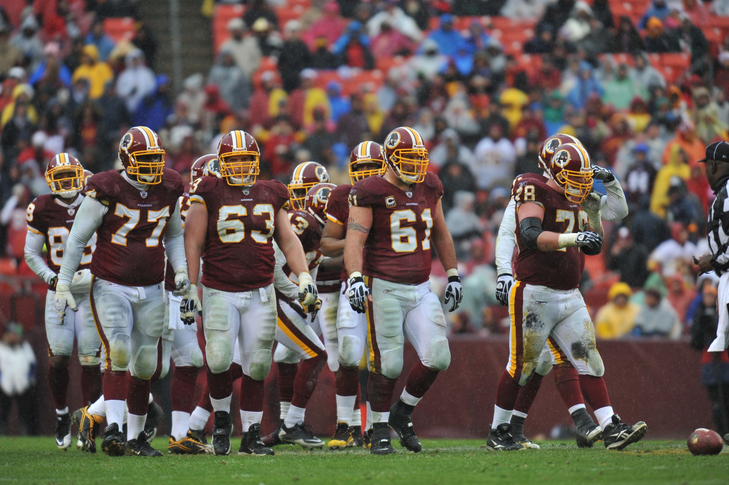 LANDOVER, MD - DECEMBER 12:  Casey Rabach #61 of the Washington Redskins walks up to the line of scrimmage with the offensive line during the game against the Tampa Bay Buccaneers  at FedExField on December 12, 2010 in Landover, Maryland. The Buccaneers d