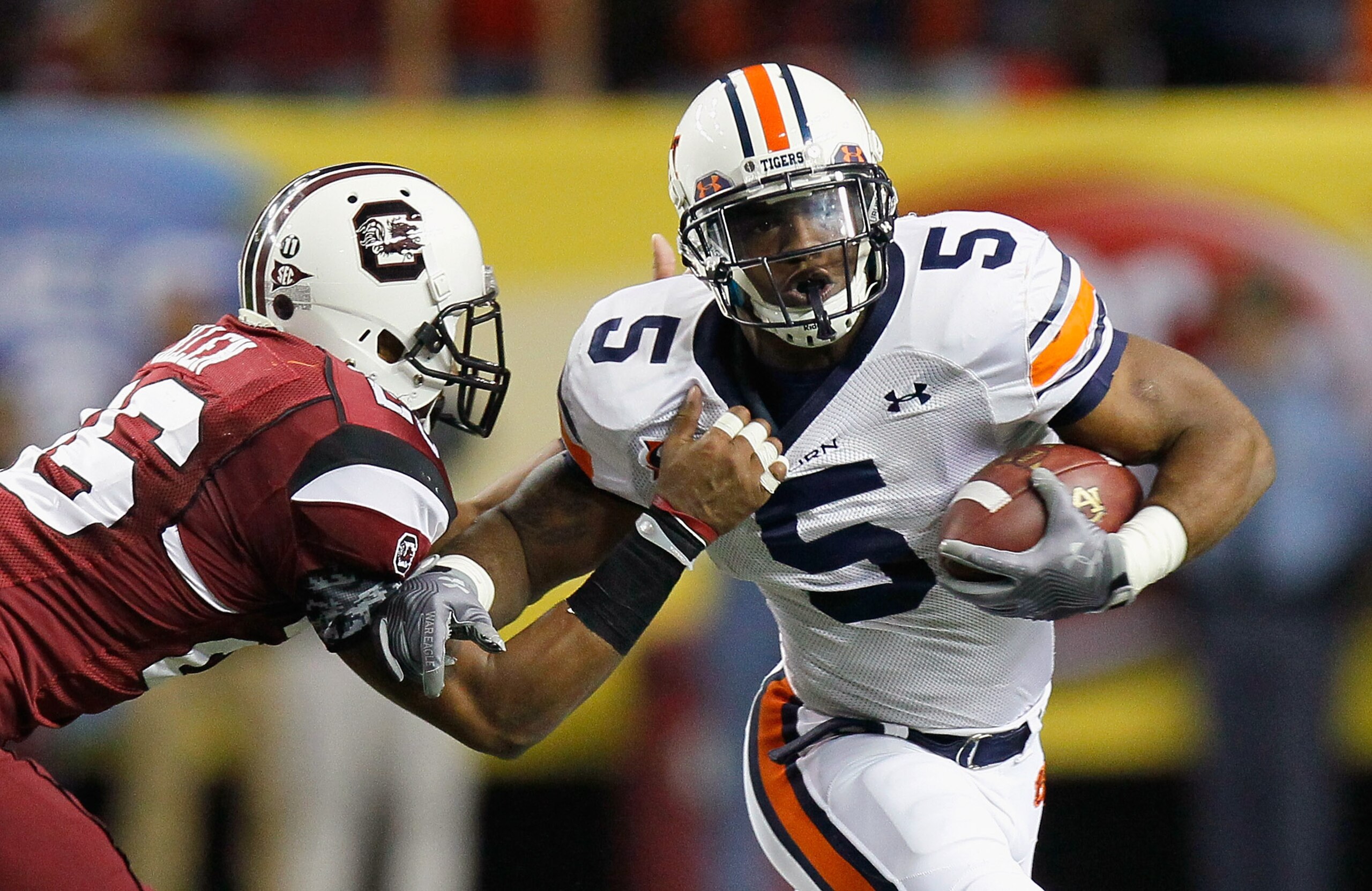 ATLANTA, GA - DECEMBER 04: Michael Dyer #5 of the Auburn Tigers is tackled by Antonio Allen #26 of the South Carolina Gamecocks during the 2010 SEC Championship at Georgia Dome on December 4, 2010 in Atlanta, Georgia. (Photo by Kevin C. Cox/Getty Images ATLANTA, GA - DECEMBER 04: Michael Dyer #5 of the Auburn Tigers is tackled by Antonio Allen #26 of the South Carolina Gamecocks during the 2010 SEC Championship at Georgia Dome on December 4, 2010 in Atlanta, Georgia. (Photo by Kevin C. Cox/Getty Images