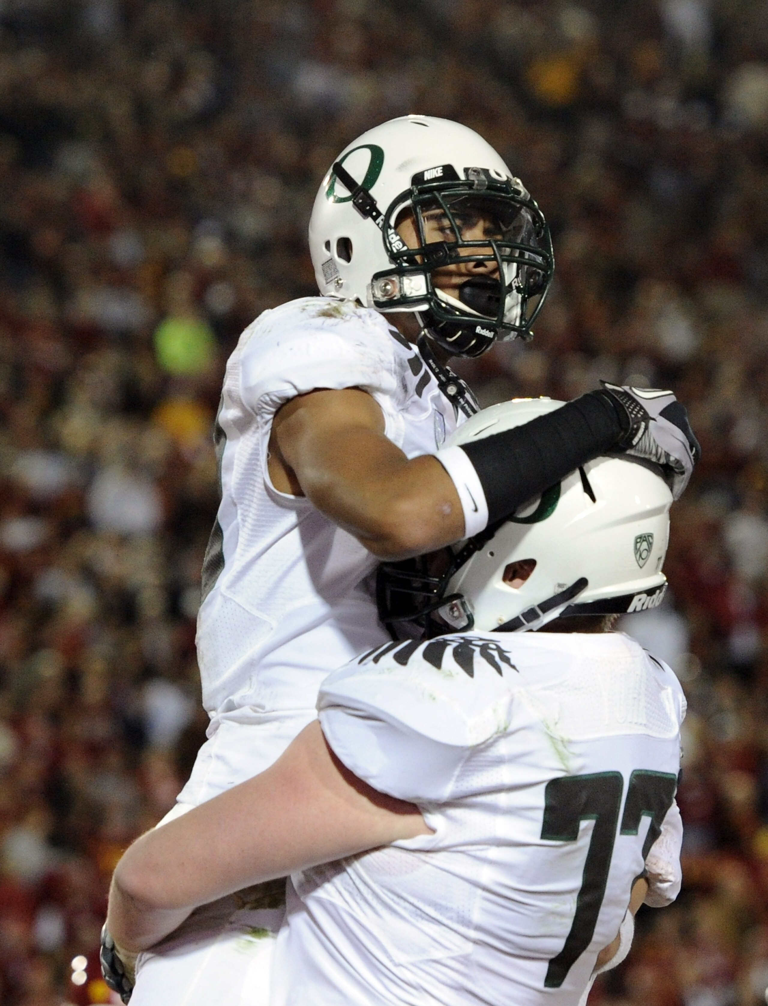 LOS ANGELES, CA - OCTOBER 30: Lavasier Tuinei #80 of the Oregon Ducks celebrates his touchdown with Carson York #77 against the USC Trojans at Los Angeles Memorial Coliseum on October 30, 2010 in Los Angeles, California. (Photo by Harry How/Getty Images LOS ANGELES, CA - OCTOBER 30: Lavasier Tuinei #80 of the Oregon Ducks celebrates his touchdown with Carson York #77 against the USC Trojans at Los Angeles Memorial Coliseum on October 30, 2010 in Los Angeles, California. (Photo by Harry How/Getty Images