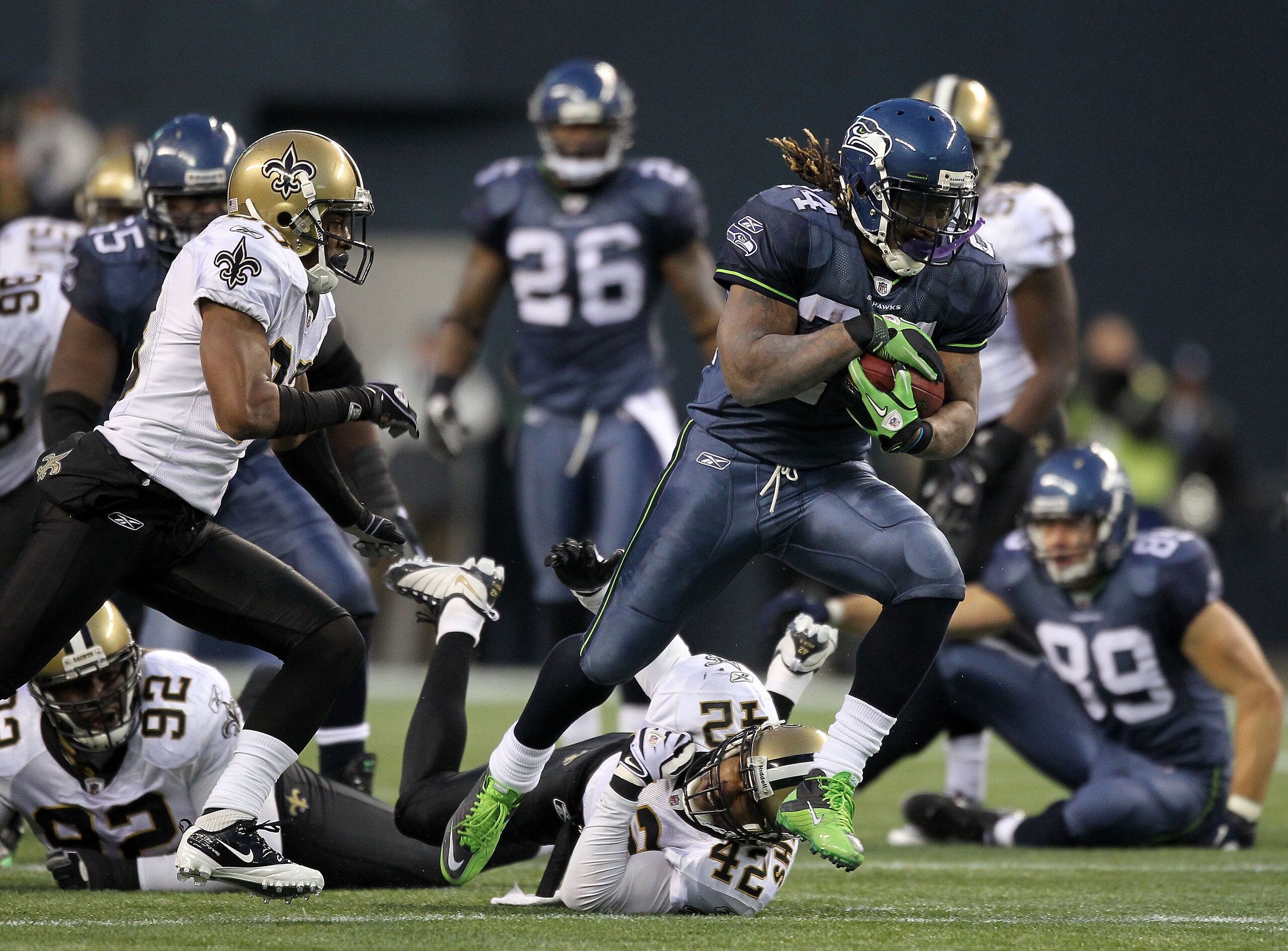 SEATTLE, WA - JANUARY 08: Running back Marshawn Lynch #24 of the Seattle Seahawks runs for a 67-yard touchdown run in the fourth quarter against the New Orleans Saints during the 2011 NFC wild-card playoff game at Qwest Field on January 8, 2011 in Seattl SEATTLE, WA - JANUARY 08: Running back Marshawn Lynch #24 of the Seattle Seahawks runs for a 67-yard touchdown run in the fourth quarter against the New Orleans Saints during the 2011 NFC wild-card playoff game at Qwest Field on January 8, 2011 in Seattl