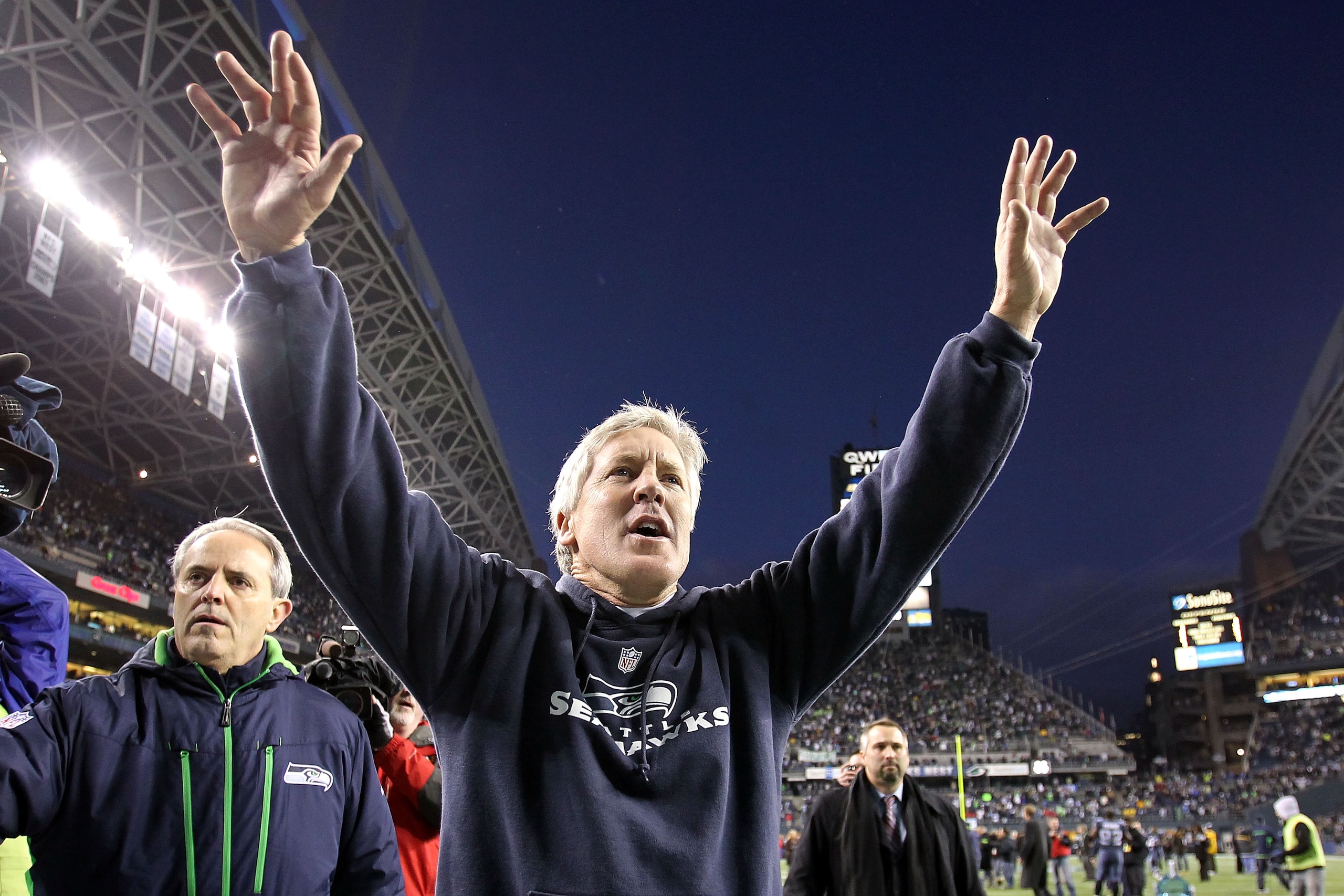 SEATTLE, WA - JANUARY 08:  Head coach Pete Carroll of the Seattle Seahawks celebrates the Seahawks 41-36 victory against the New Orleans Saints during the 2011 NFC wild-card playoff game at Qwest Field on January 8, 2011 in Seattle, Washington.  (Photo by