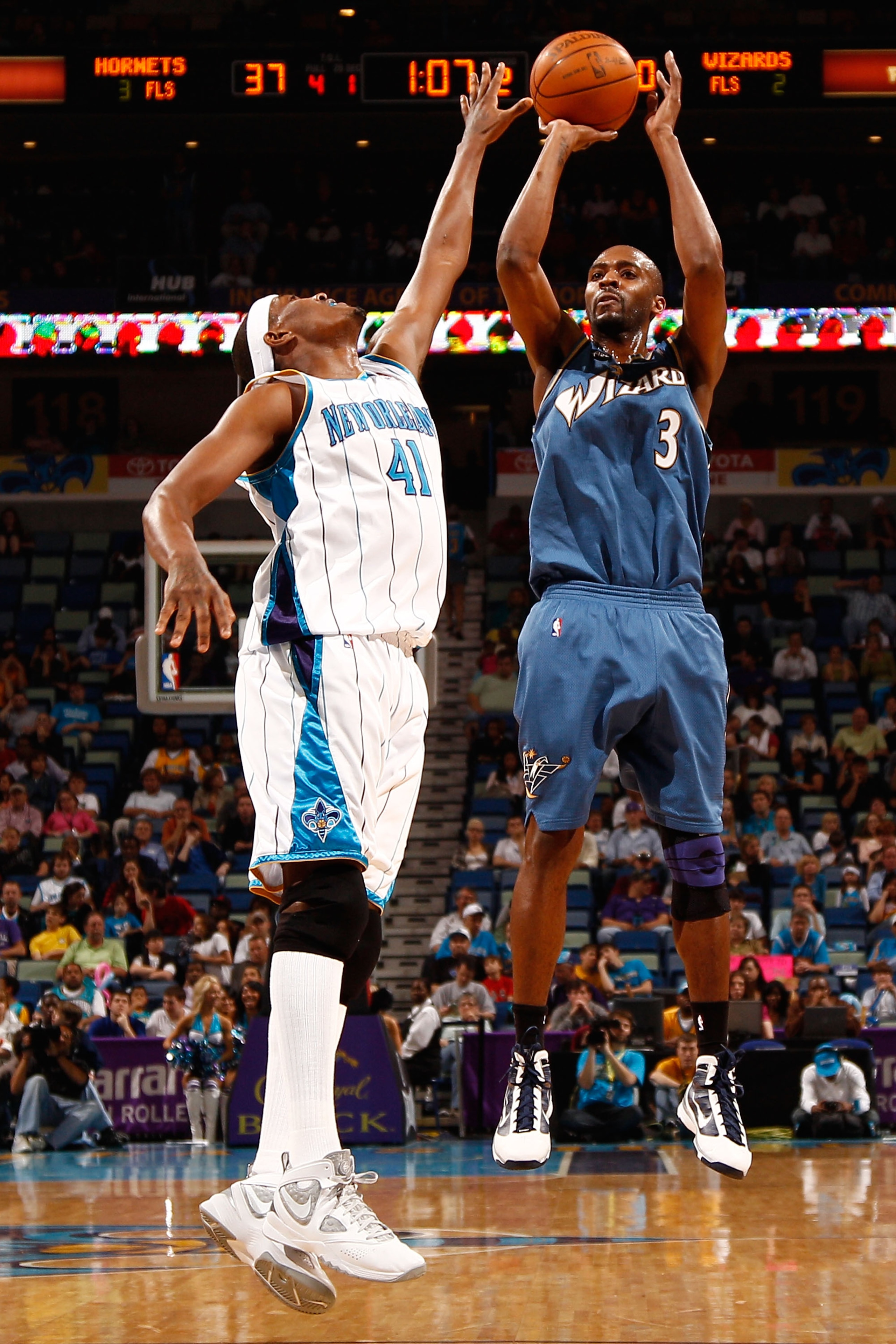 NEW ORLEANS - MARCH 31:  Quinton Ross #3 of the Washington Wizards shoots the ball over James Posey #41 of the New Orleans Hornets at New Orleans Arena on March 31, 2010 in New Orleans, Louisiana.  NOTE TO USER: User expressly acknowledges and agrees that