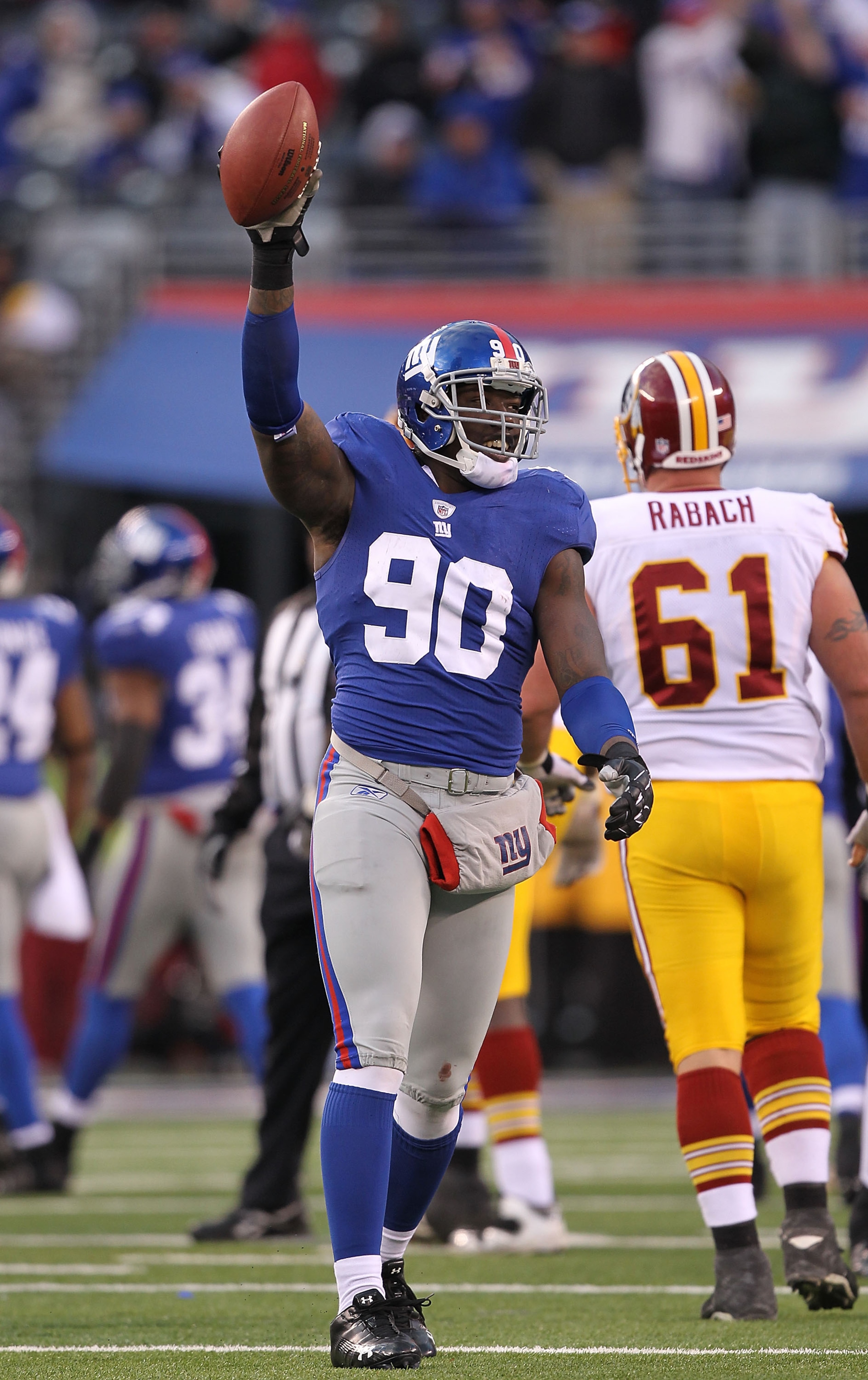 EAST RUTHERFORD, NJ - DECEMBER 05:  Jason Pierre-Paul #90 of the New York Giants celebrates running back a fumble by the Washington Redskins during their game on December 5, 2010 at The New Meadowlands Stadium in East Rutherford, New Jersey.  (Photo by Al
