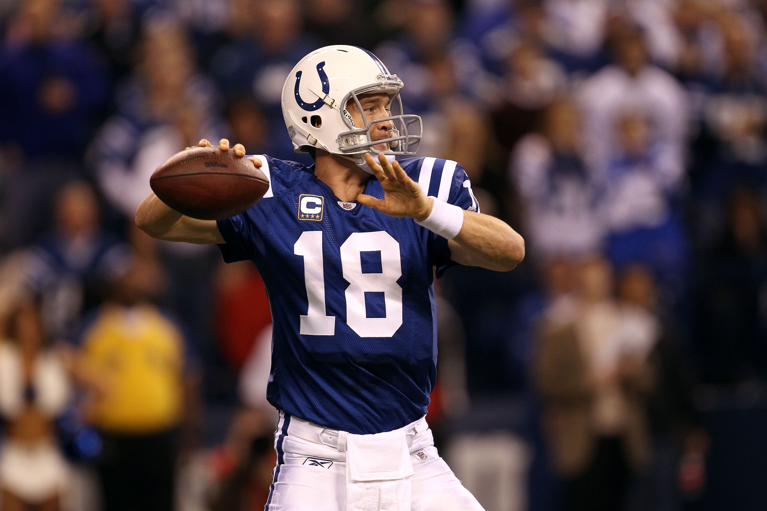 INDIANAPOLIS, IN - JANUARY 08:  Quarterback Peyton Manning #18 of the Indianapolis Colts passes the ball in the first quarter against the New York Jets during their 2011 AFC wild card playoff game at Lucas Oil Stadium on January 8, 2011 in Indianapolis, I