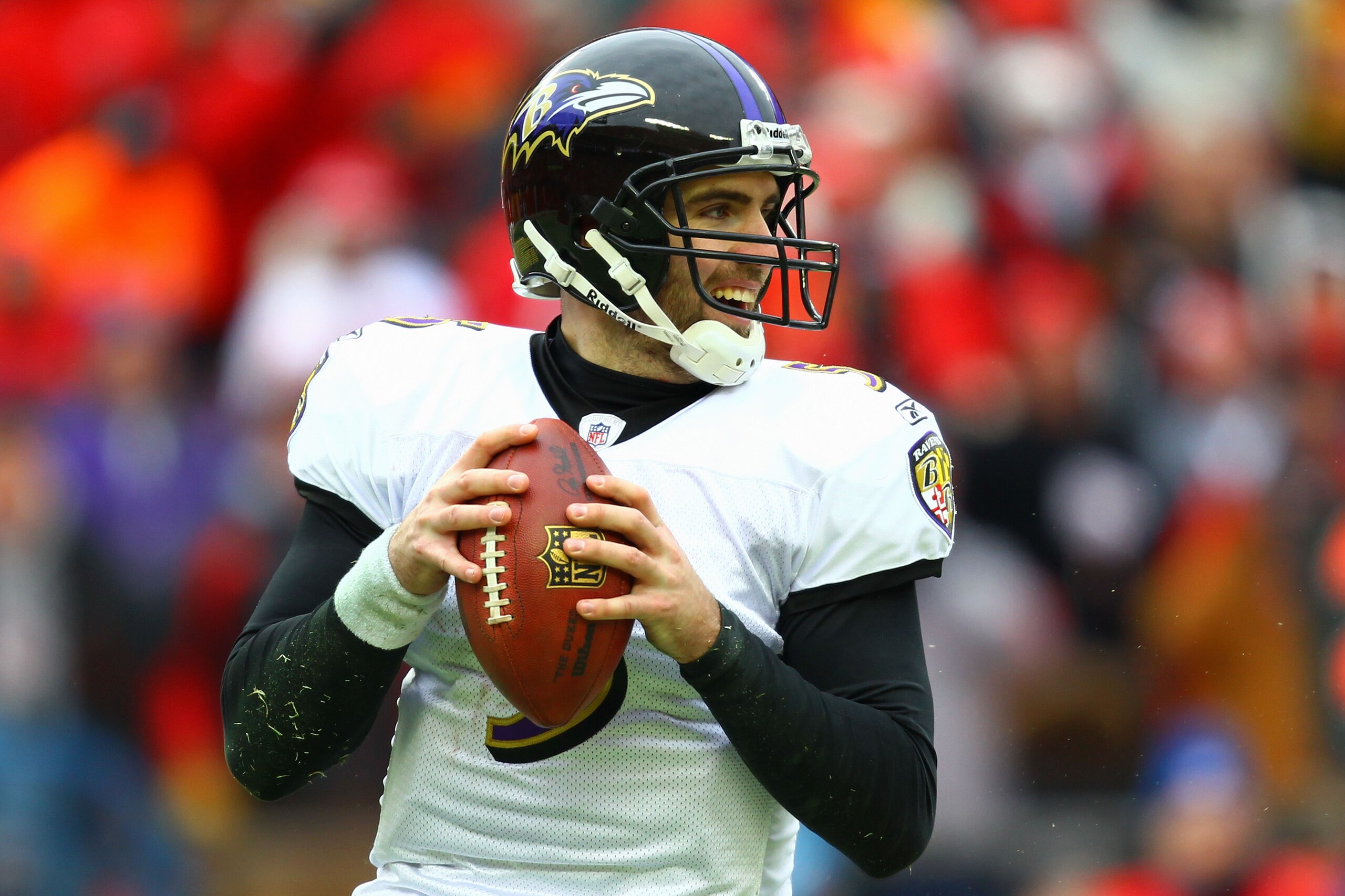 KANSAS CITY, MO - JANUARY 09:  Quarterback Joe Flacco #5 of the Baltimore Ravens looks to pass against the Kansas City Chiefs in their 2011 AFC wild card playoff game at Arrowhead Stadium on January 9, 2011 in Kansas City, Missouri.  (Photo by Dilip Vishw
