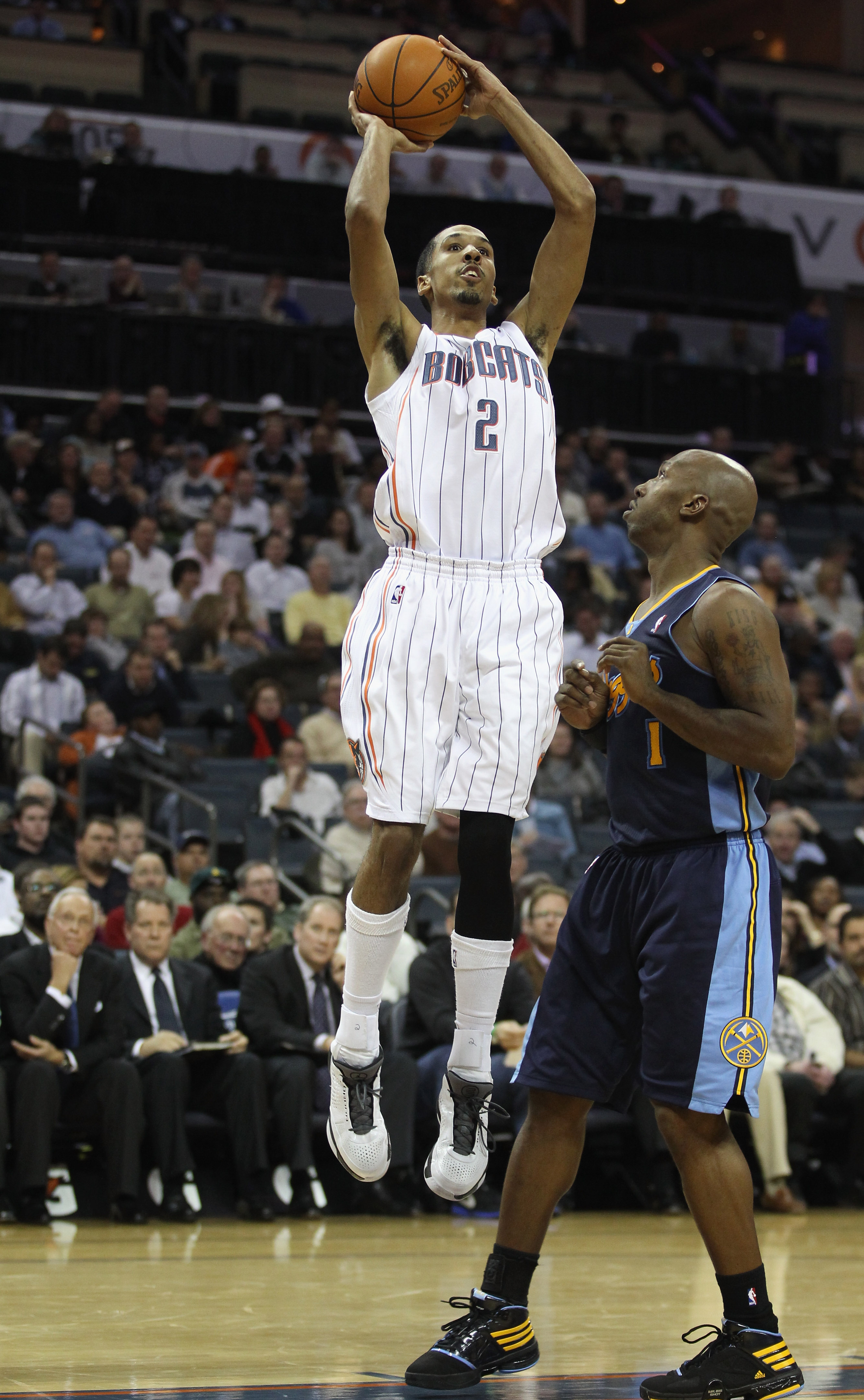 CHARLOTTE, NC - DECEMBER 07:  Chauncey Billups #1 of the Denver Nuggets watches a shot by Shaun Livingston #2 of the Charlotte Bobcats during their game at Time Warner Cable Arena on December 7, 2010 in Charlotte, North Carolina.  NOTE TO USER: User expre