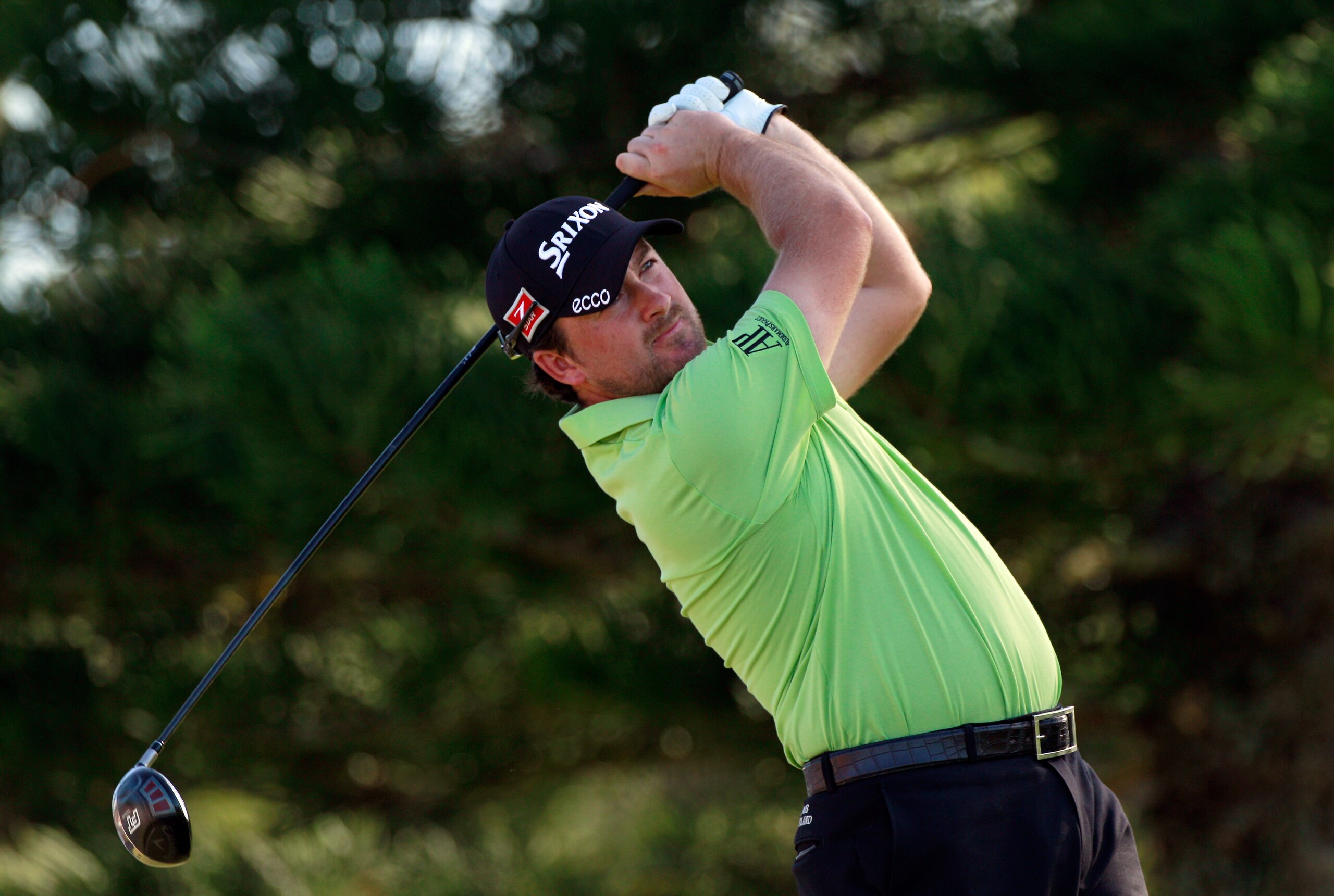 KAPALUA, HI - JANUARY 09:  Graeme McDowell of Northern Ireland hits a shot on the 18th hole during the final round of the Hyundai Tournament of Champions at the Plantation course on January 9, 2011 in Kapalua, Hawaii.  (Photo by Sam Greenwood/Getty Images
