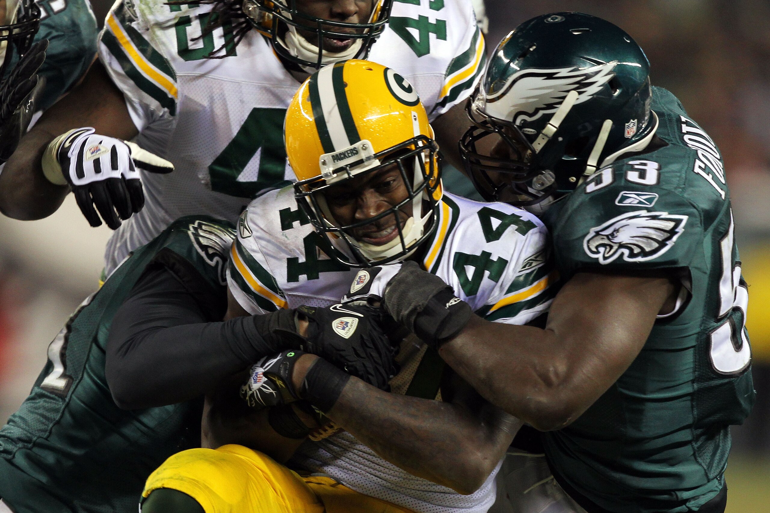 PHILADELPHIA, PA - JANUARY 09:  James Starks #44 of the Green Bay Packers is tackled by Moise Fokou #53 of the Philadelphia Eagles during the 2011 NFC wild card playoff game at Lincoln Financial Field on January 9, 2011 in Philadelphia, Pennsylvania.  (Ph