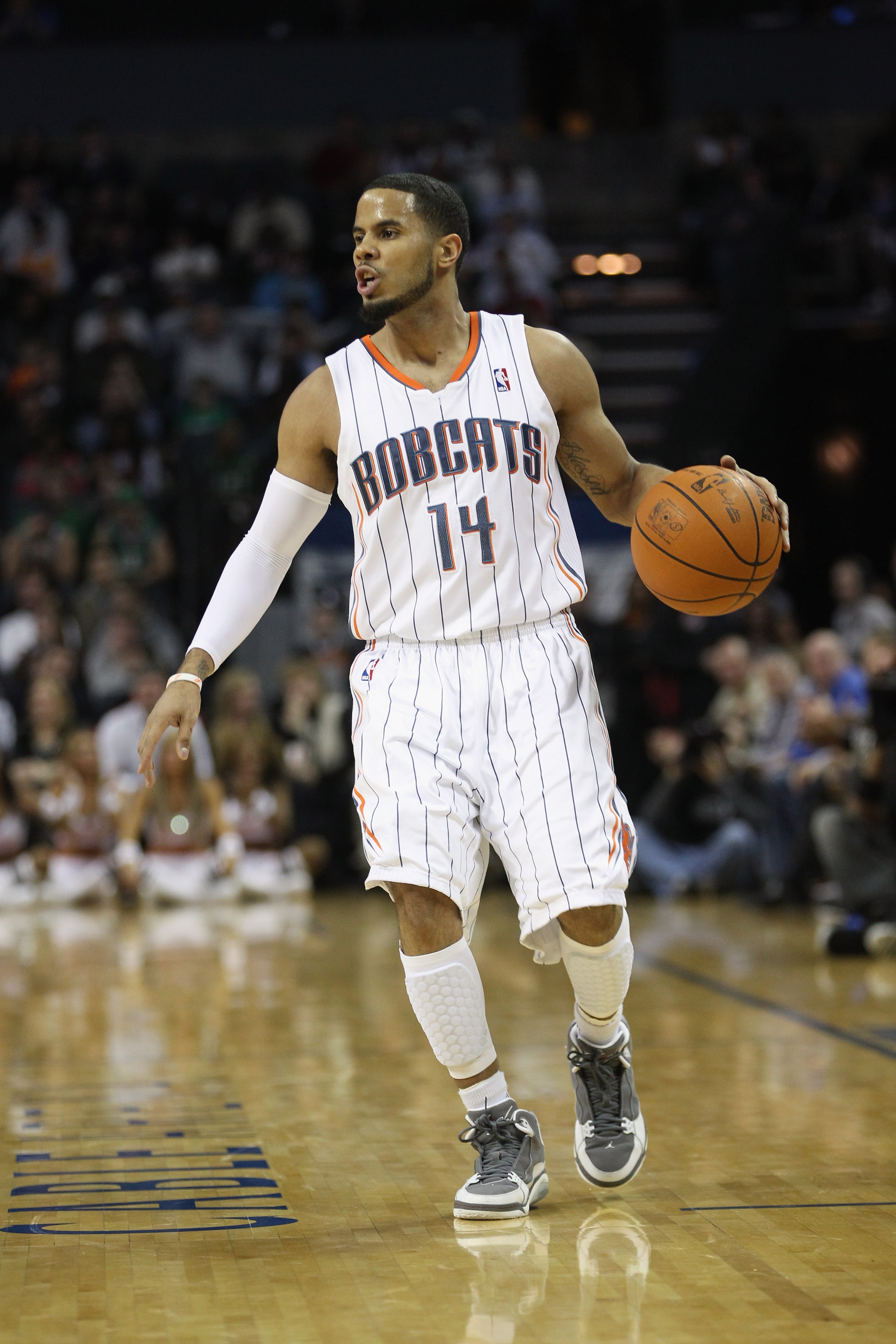 CHARLOTTE, NC - DECEMBER 11:  D.J. Augustin #14 of the Charlotte Bobcats against the Boston Celtics during their game at Time Warner Cable Arena on December 11, 2010 in Charlotte, North Carolina. NOTE TO USER: User expressly acknowledges and agrees that,