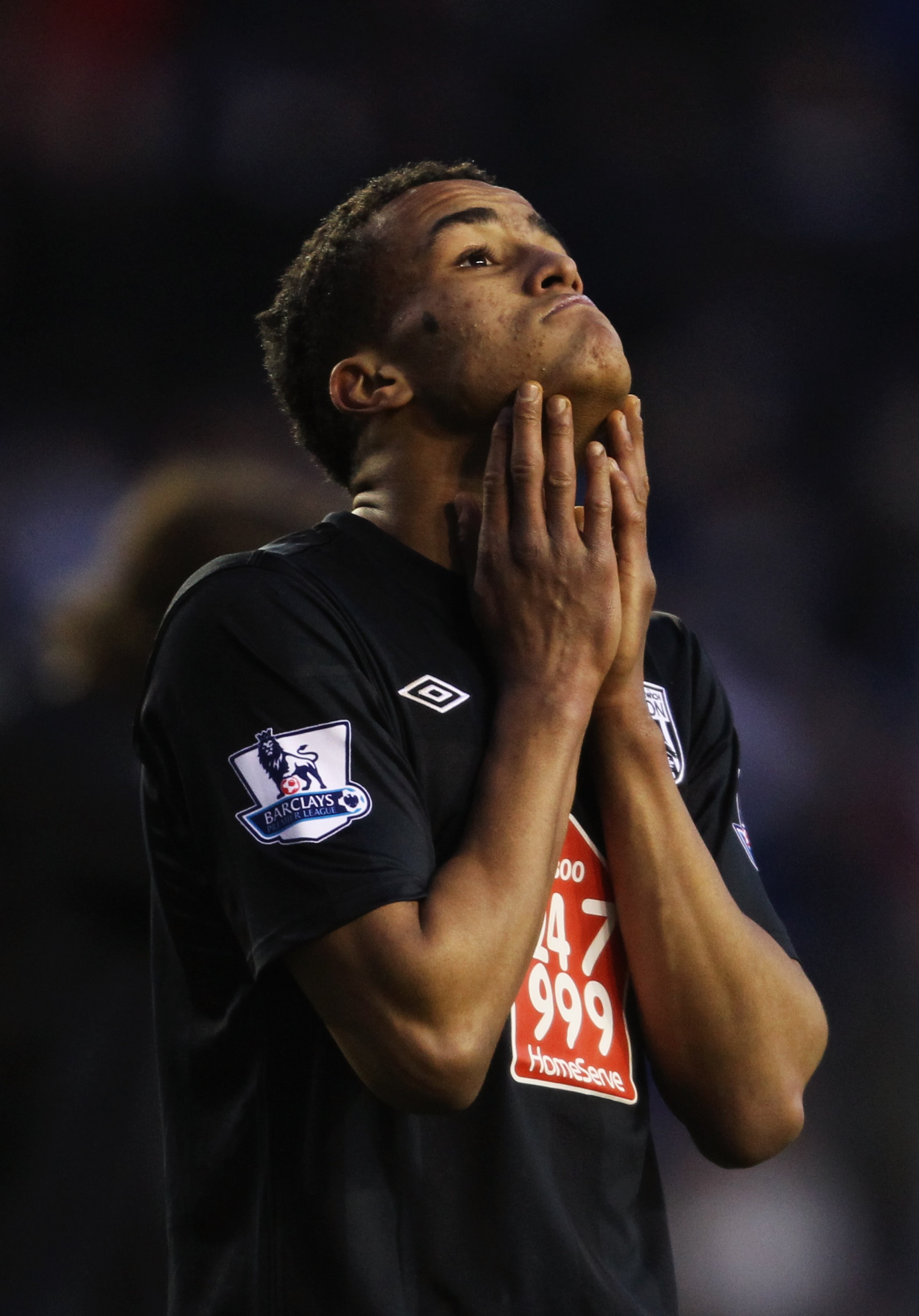 READING, ENGLAND - JANUARY 08: James Hurst of West Bromwich Albion reacts as team mate Jonas Olsson is sent off during the FA Cup sponsored by E.ON 3rd round match between Reading and West Bromwich Albion at Madejski Stadium on January 8, 2011 in Reading,