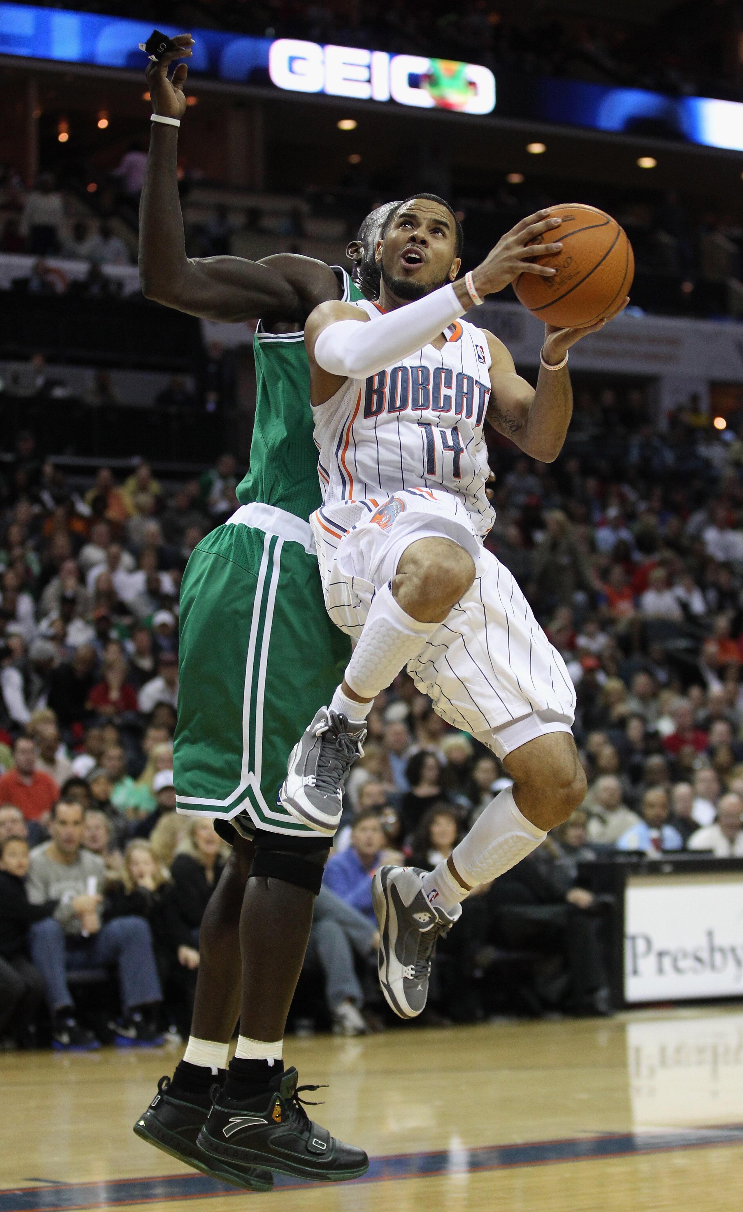 CHARLOTTE, NC - DECEMBER 11:  D.J. Augustin #14 of the Charlotte Bobcats against the Boston Celtics during their game at Time Warner Cable Arena on December 11, 2010 in Charlotte, North Carolina. NOTE TO USER: User expressly acknowledges and agrees that,