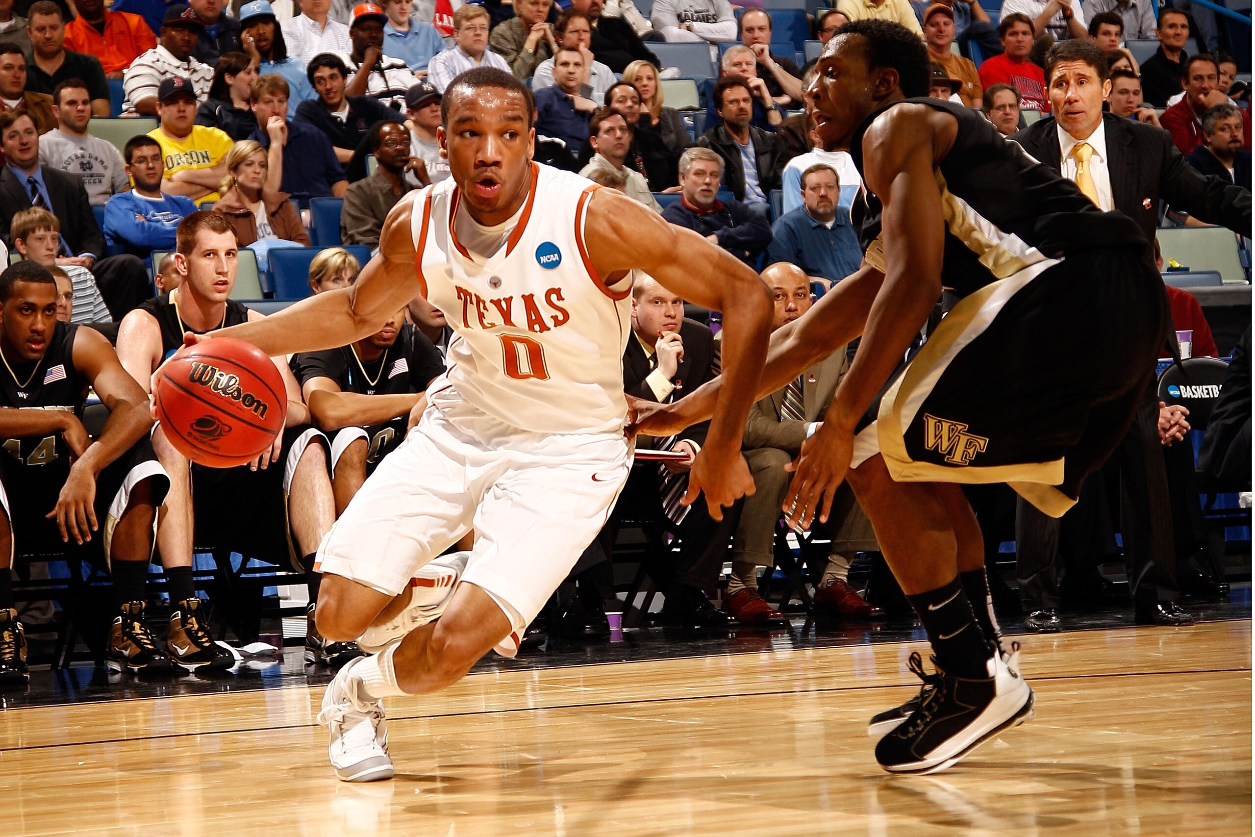 NEW ORLEANS - MARCH 18:  Avery Bradley #0 of the Texas Longhorns drives the ball around Ishmael Smith #10 of the Wake Forest Demon Deacons during the first round of the 2010 NCAA menï¿½s basketball tournament at the New Orleans Arena on March 18, 2010 in Ne