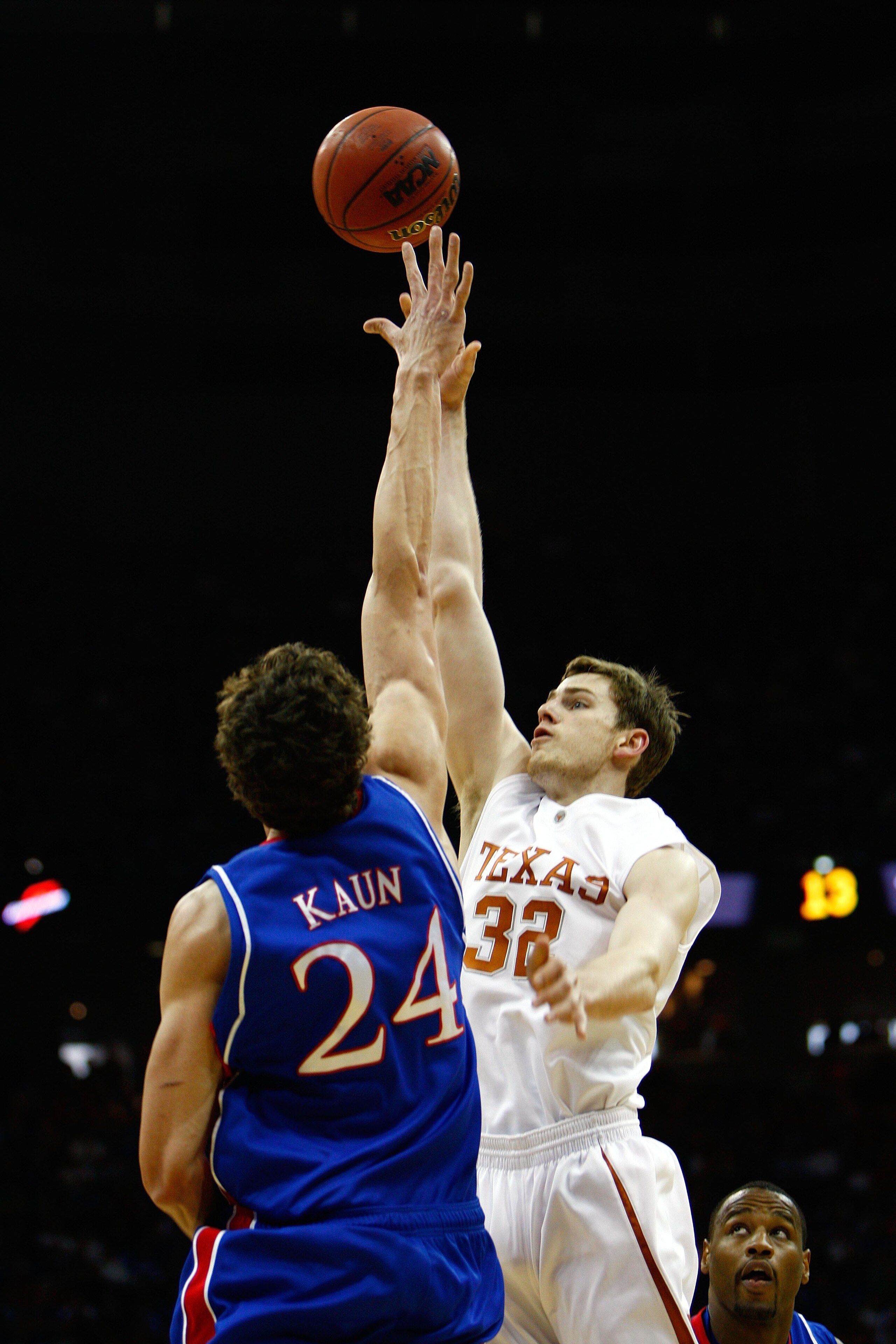 KANSAS CITY, MO - MARCH 16:  Connor Atchley #32 of the Texas Longhorns shoots the one-handed jump shot against Sasha Kaun #24 of the Kansas Jayhawks during the Big 12 Men's Basketball Tournament Finals on March 16, 2008 at the Sprint Center in Kansas City