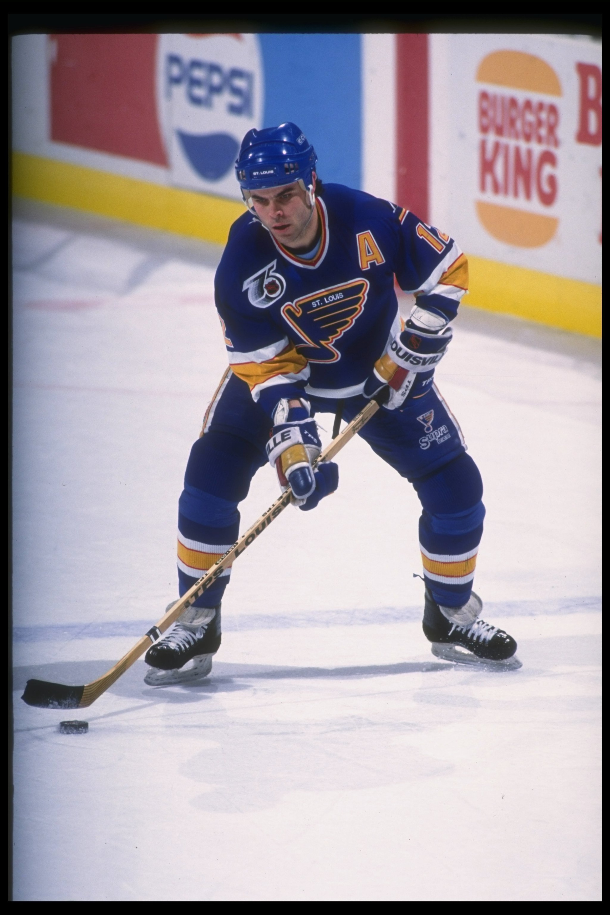 11 Dec 1991:  Center Adam Oates of the St. Louis Blues moves the puck during a game against the Buffalo Sabres at Memorial Auditorium in Buffalo, New York. Mandatory Credit: Rick Stewart  /Allsport