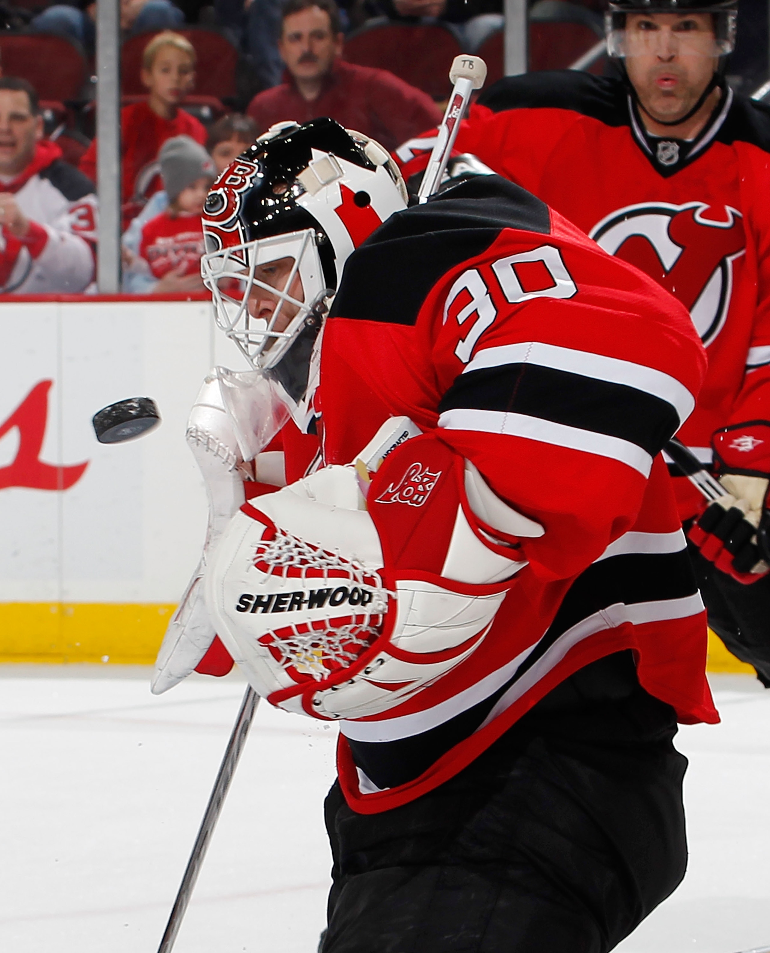NEWARK, NJ - JANUARY 09:  Goalie Martin Brodeur #30 of the New Jersey Devils makes a save against the Tampa Bay Lightning in the first period of an NHL hockey game at the Prudential Center on January 9, 2011 in Newark, New Jersey.  (Photo by Paul Bereswil