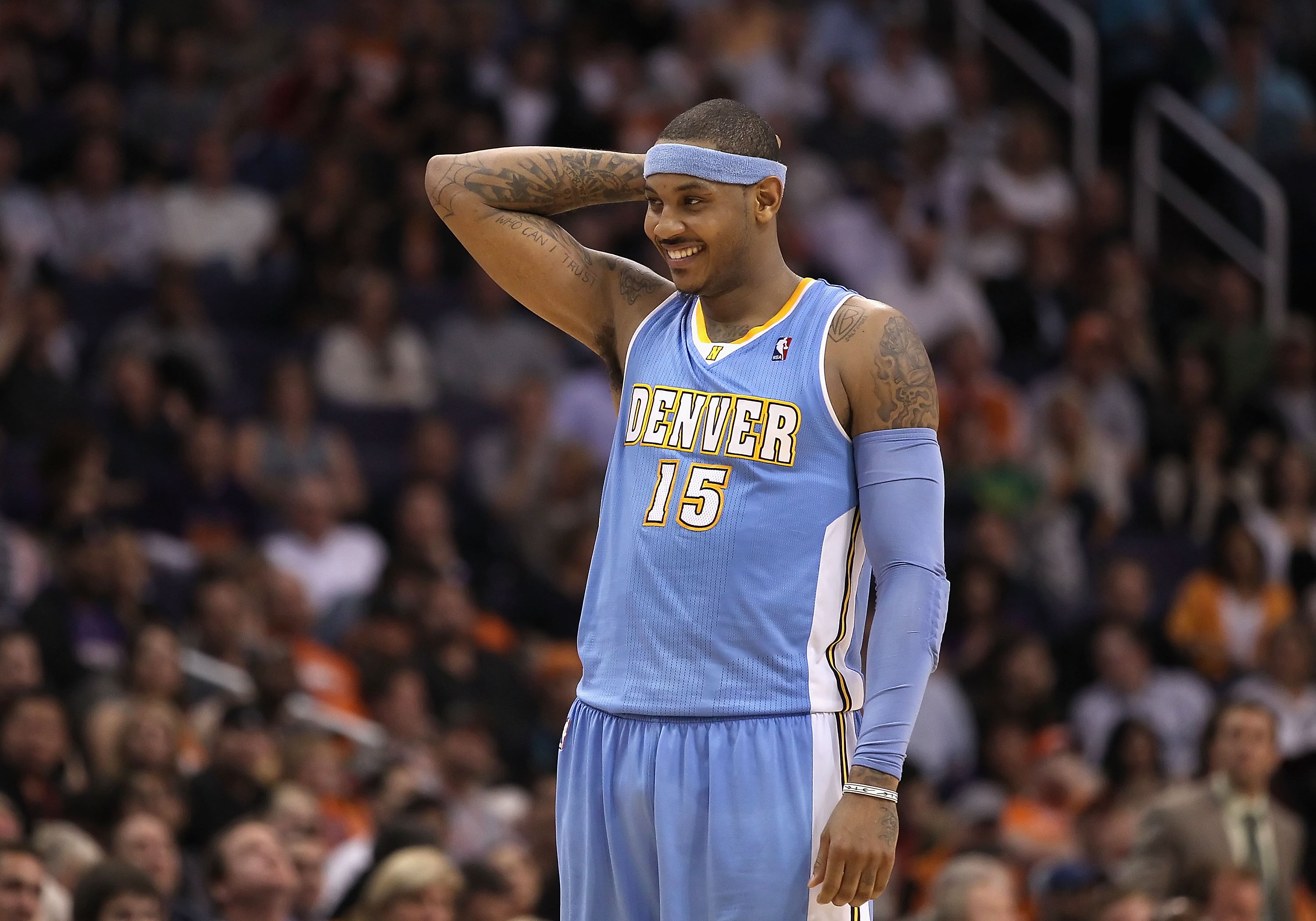 Carmelo Anthony of the Denver Nuggets stands on the court during