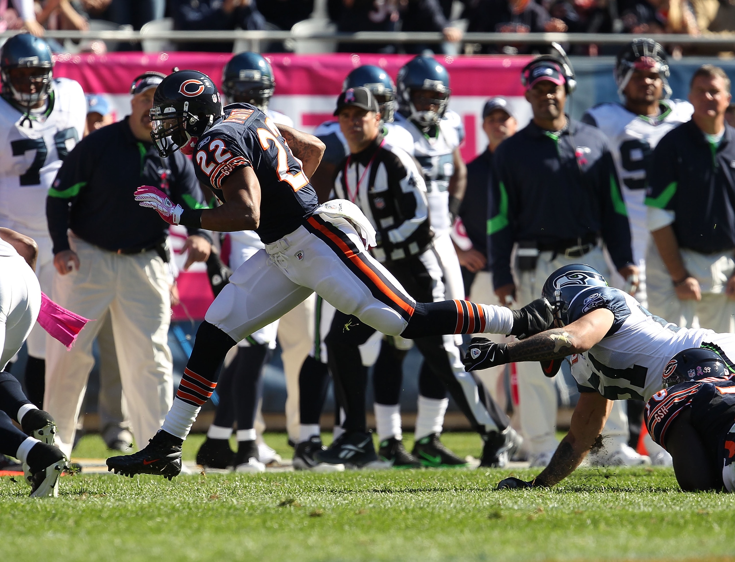 CHICAGO - OCTOBER 17: Matt Forte #22 of the Chicago Bears runs over Lofa Tatupu #51 of the Seattle Seahawks at Soldier Field on October 17, 2010 in Chicago, Illinois. The Seahawks defeated the Bears 23-20. (Photo by Jonathan Daniel/Getty Images)