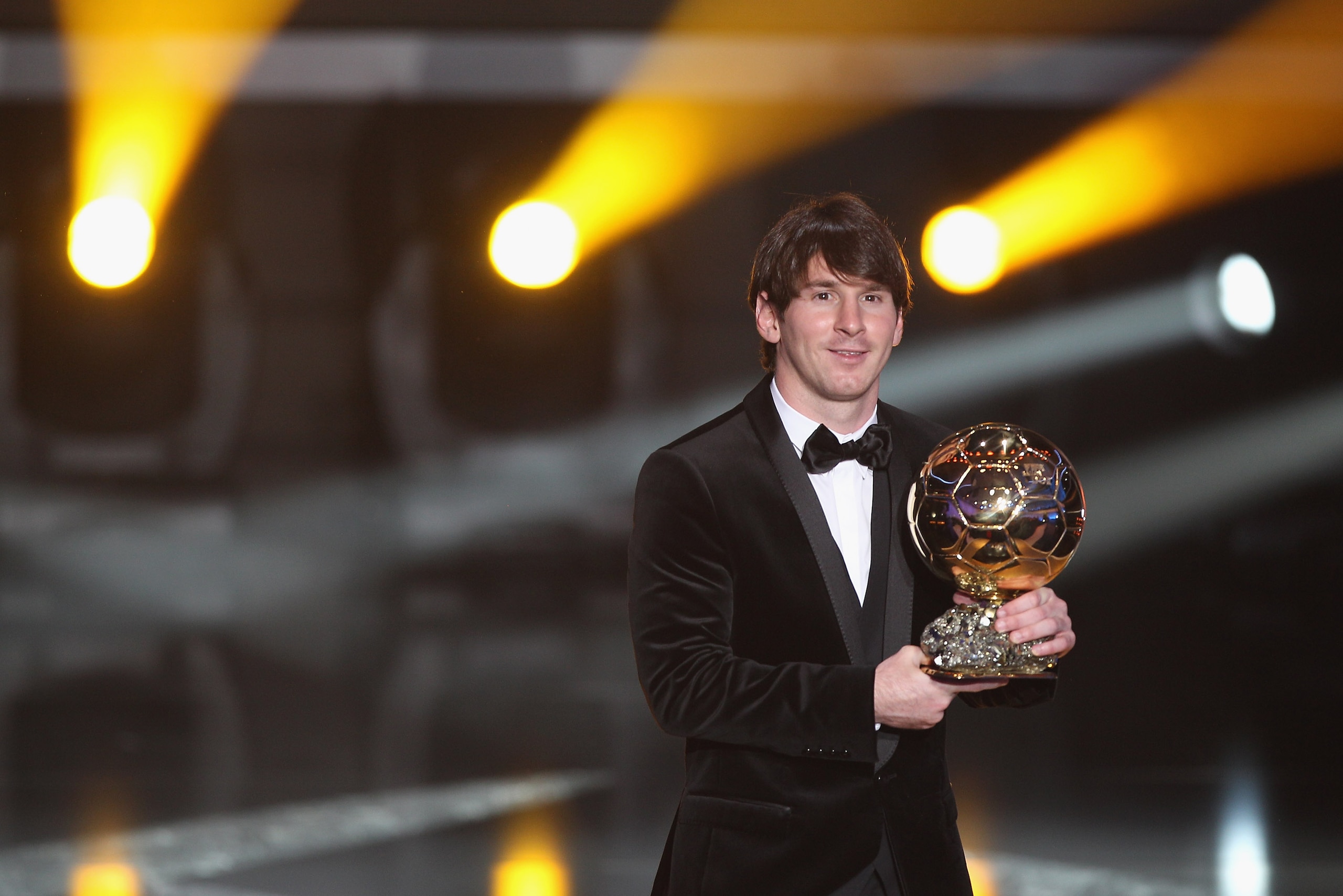 ZURICH, SWITZERLAND - JANUARY 10:  Lionel Messi of Argentina and Barcelona FC receives the men's player of the year award during the FIFA Ballon d'or Gala at the Zurich Kongresshaus on January 10, 2011 in Zurich, Switzerland.  (Photo by Michael Steele/Get