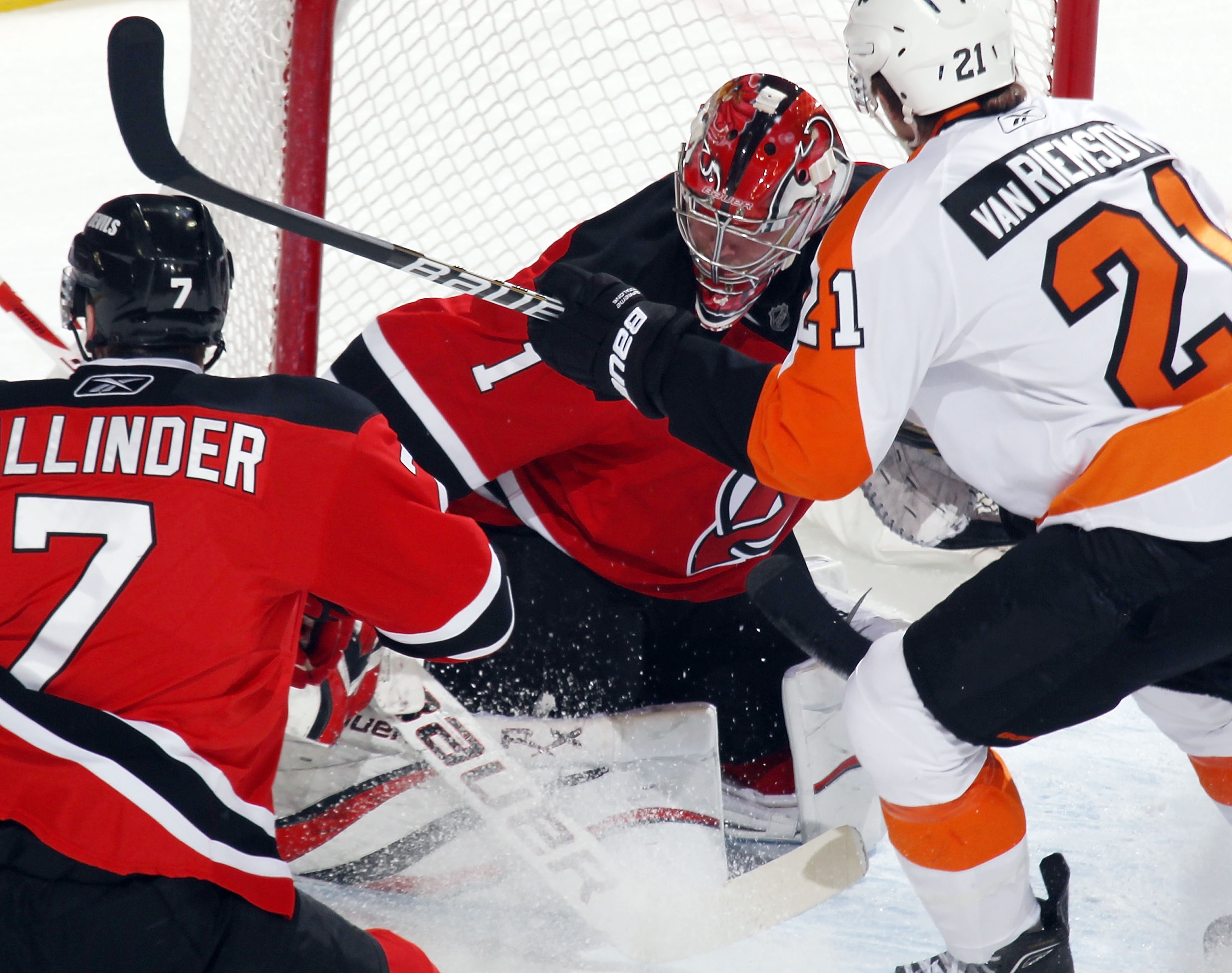 NEWARK, NJ - JANUARY 06: Johan Hedberg #1 of the New Jersey Devils looks for the puck in a crowd during the game against the Philadelphia Flyers at the Prudential Center on January 6, 2011 in Newark, New Jersey.  (Photo by Bruce Bennett/Getty Images)