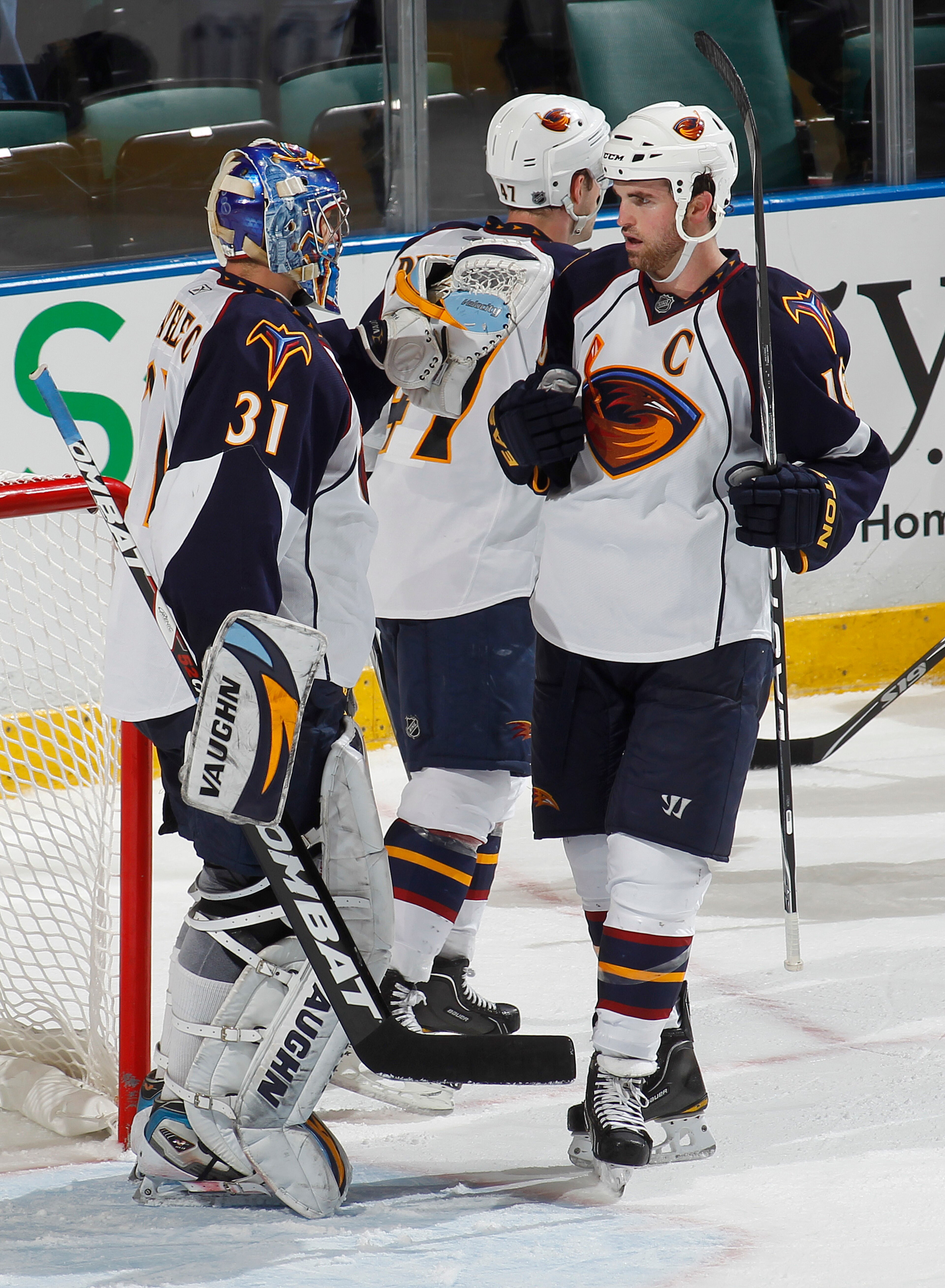 SUNRISE, FL - JANUARY 5: Goaltender Ondrej Pavelec #31 is congratulated by Andrew Ladd #16 of the Atlanta Thrashers after defeating the Florida Panthers 3-2 on January 5, 2011 at the BankAtlantic Center in Sunrise, Florida.  (Photo by Joel Auerbach/Getty