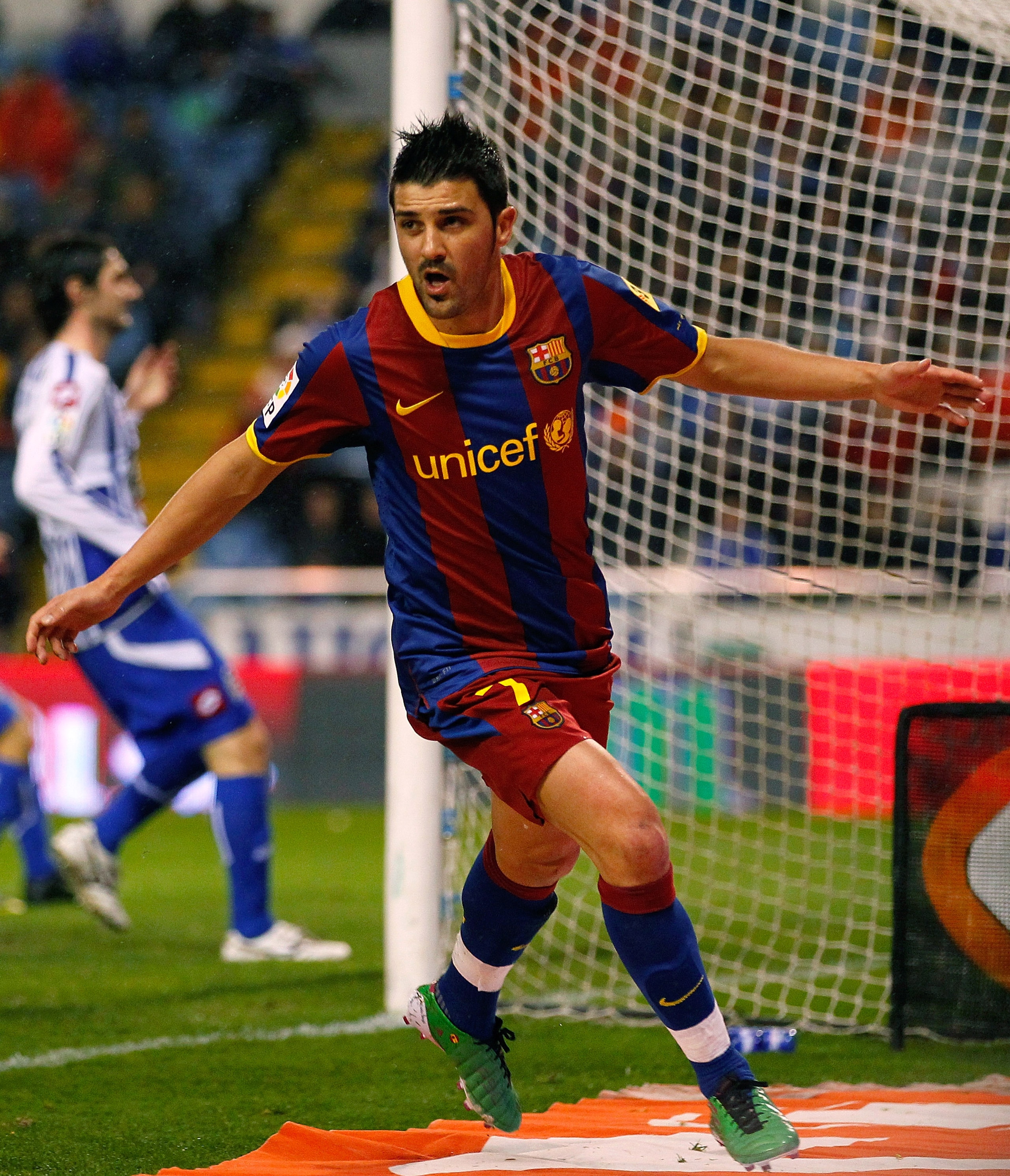 LA CORUNA, SPAIN - JANUARY 08:  David Villa of Barcelona celebrates after scoring the opening goal of the La Liga match between Deportivo La Coruna and Barcelona at Riazor Stadium on January 8, 2011 in A Coruna, Spain.  (Photo by Angel Martinez/Getty Imag