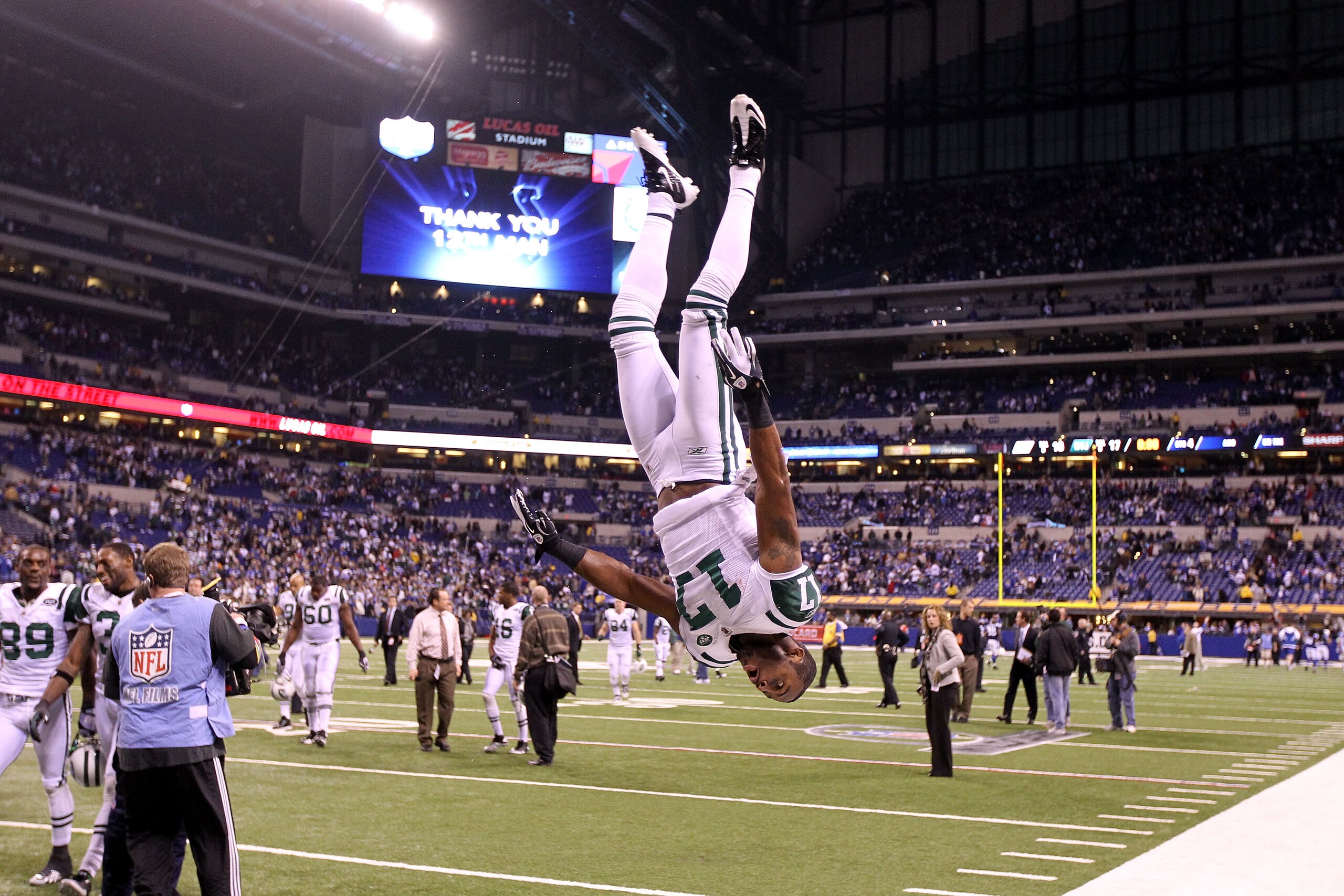 INDIANAPOLIS, IN - JANUARY 08:  Braylon Edwards #17 of the New York Jets does a flip in celebration of the Jets 17-16 win against the Indianapolis Colts during their 2011 AFC wild card playoff game at Lucas Oil Stadium on January 8, 2011 in Indianapolis,